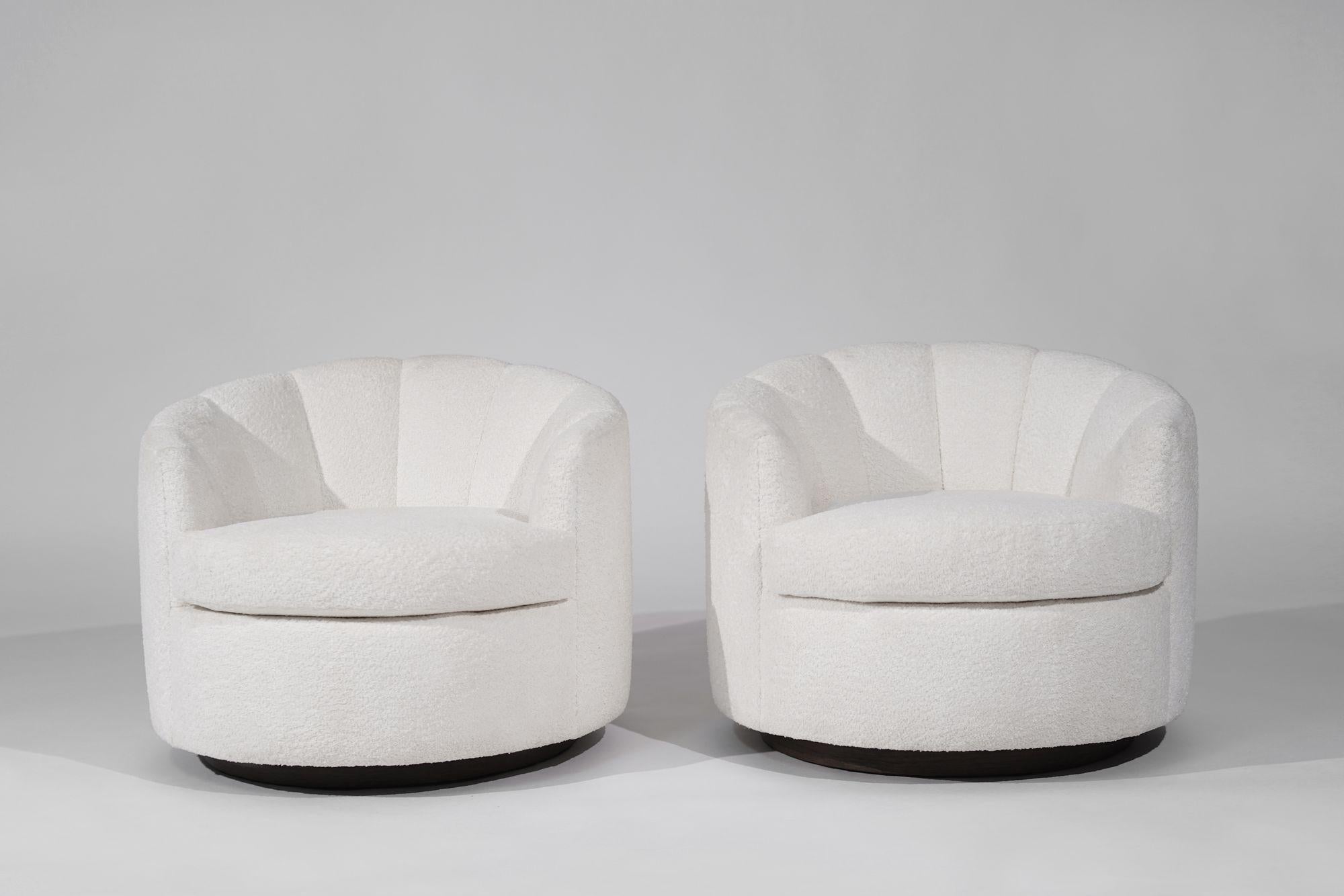 Enhance your space with this exquisite set of Mid-Century Modern swivel chairs by Directional, crafted circa 1970-1979. Meticulously restored, each chair features a new cushion and is luxuriously reupholstered in Italian bouclé, exuding timeless