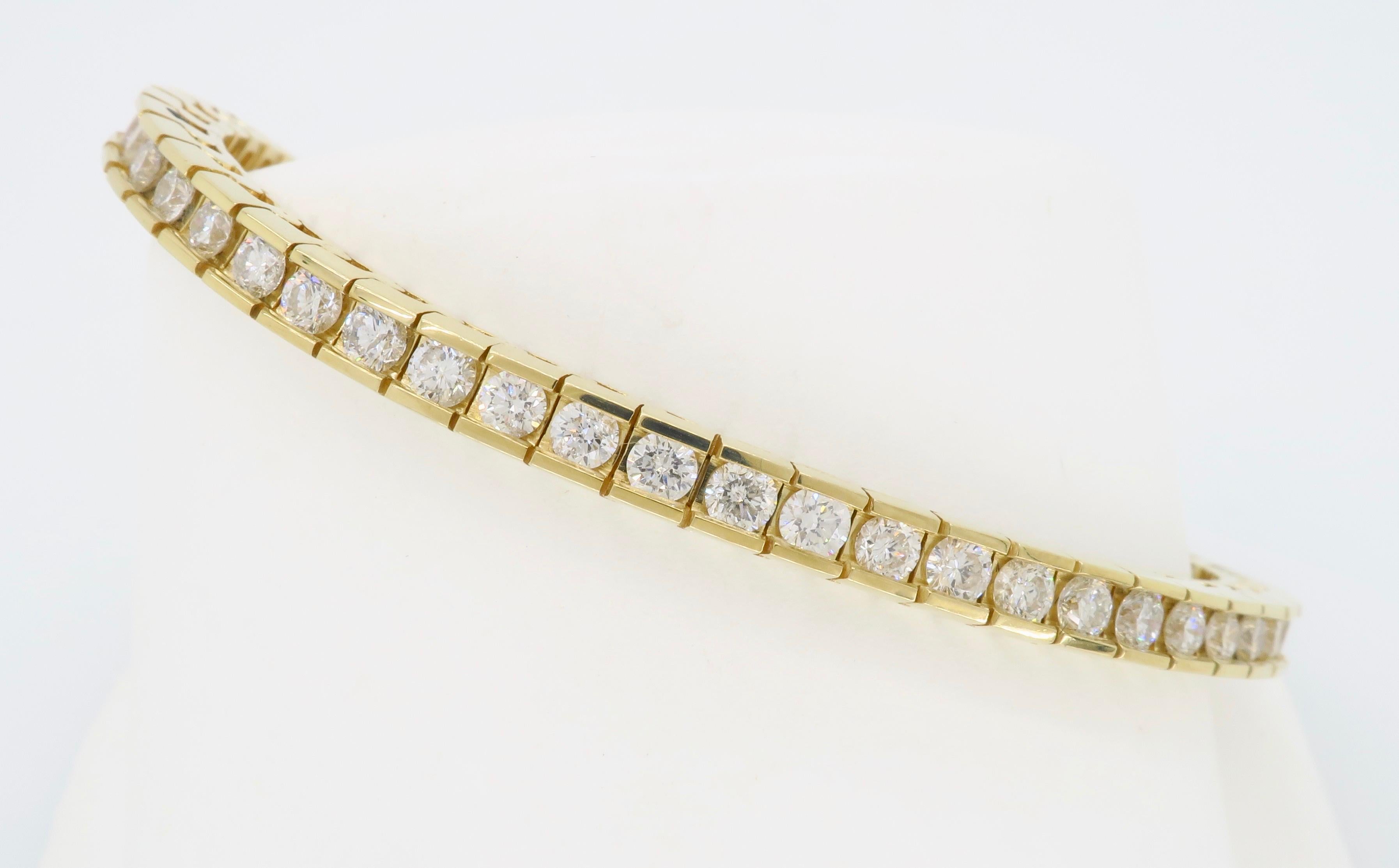 Classic 14k yellow gold diamond tennis bracelet with 5.50ctw of channel set Round Brilliant cut diamonds. 

Diamond Carat Weight: Approximately 5.50CTW
Diamond Cut: 56 Round Brilliant Cut Diamonds
Color: Average G-I
Clarity: Average SI2-I1
Metal: