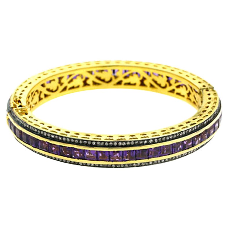 Bracciale con ametista incastonata in oro 14k e bordi di diamanti
