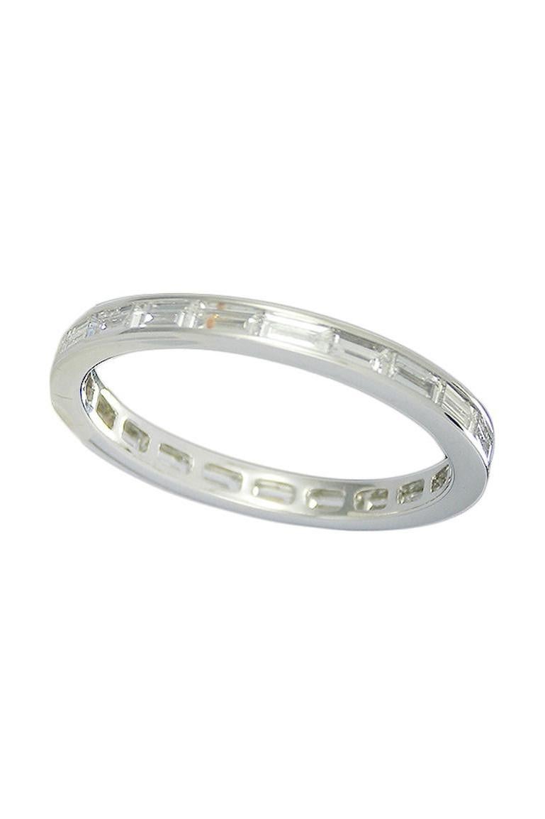 A gorgeous Diamond Eternity Band , wedding band , inspired by the Art Deco style.​
Crafted in White Gold, this feminine band is made of 21 Baguette Cut Diamonds held in a fully Channel Setting, carrying around the entire surface of the ring. ​

Ring