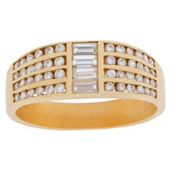 Vintage Channel-Set Baguette & Round Diamond Ring in 14k Gold. 0.70 Carats in Diamonds