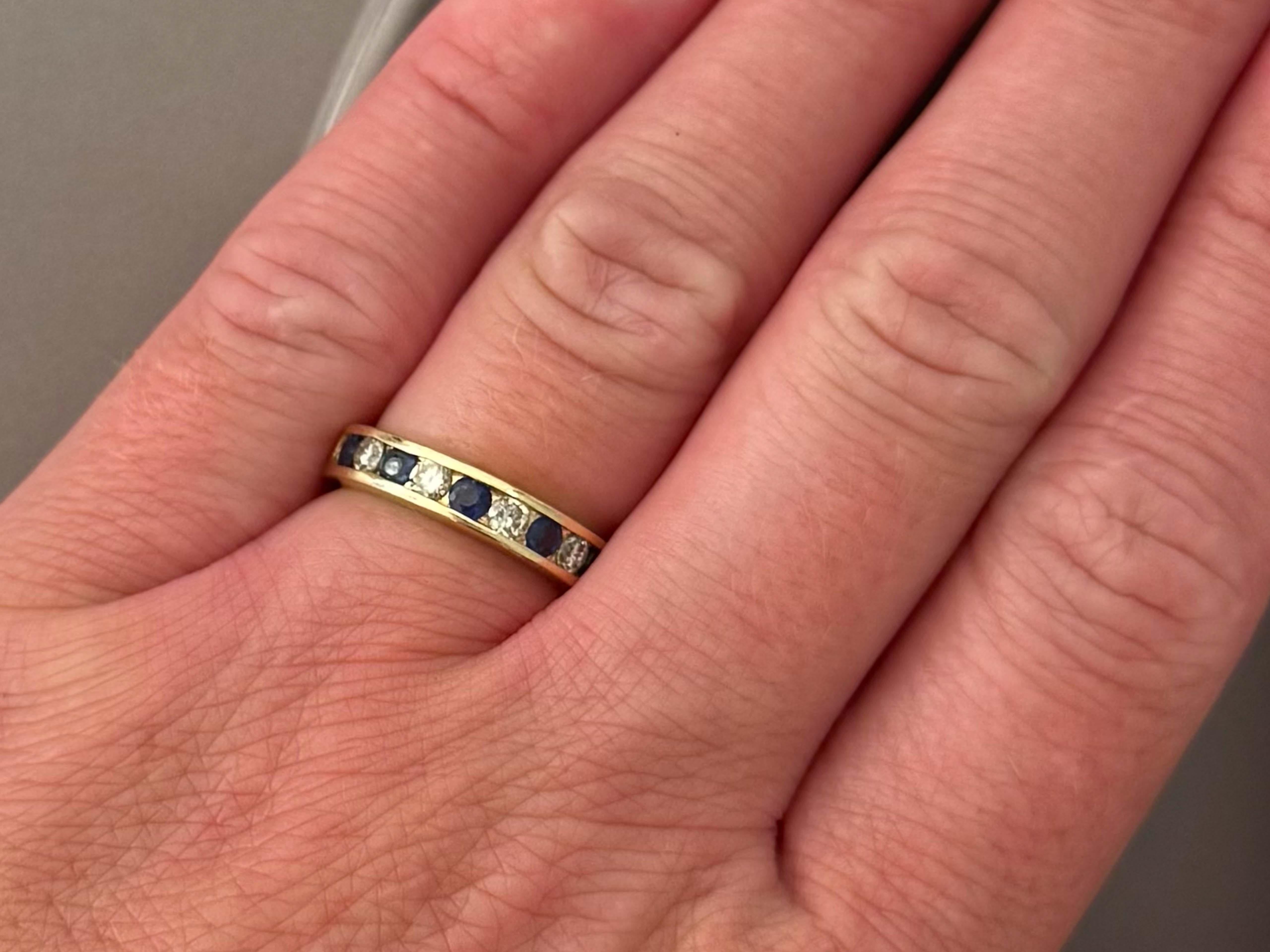 Channel Set Blue Sapphire and Diamond Band Ring 14K Yellow Gold

Item Specifications:

Metal: 14K Yellow Gold

Ring Size: 5.5 (resizing available for a fee)

Ring Height: 4 mm tall

Total Weight: 4.1 Grams

Diamond Count: 4 brilliant cut