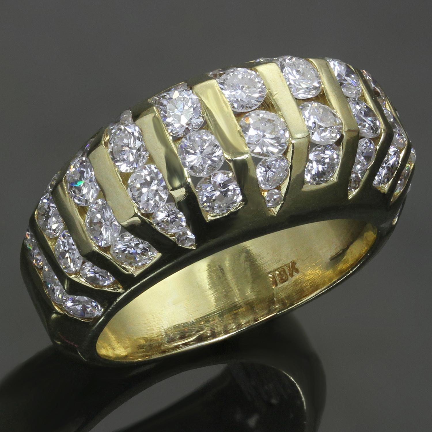 This elegant estate women's ring features a domed design crafted in 18k yellow gold and accented with 11 vertical rows channel-set with round brilliant-cut G-H VS2-SI1 diamonds weighing an estimated 3.5 carats. Made in United States circa 1980s.