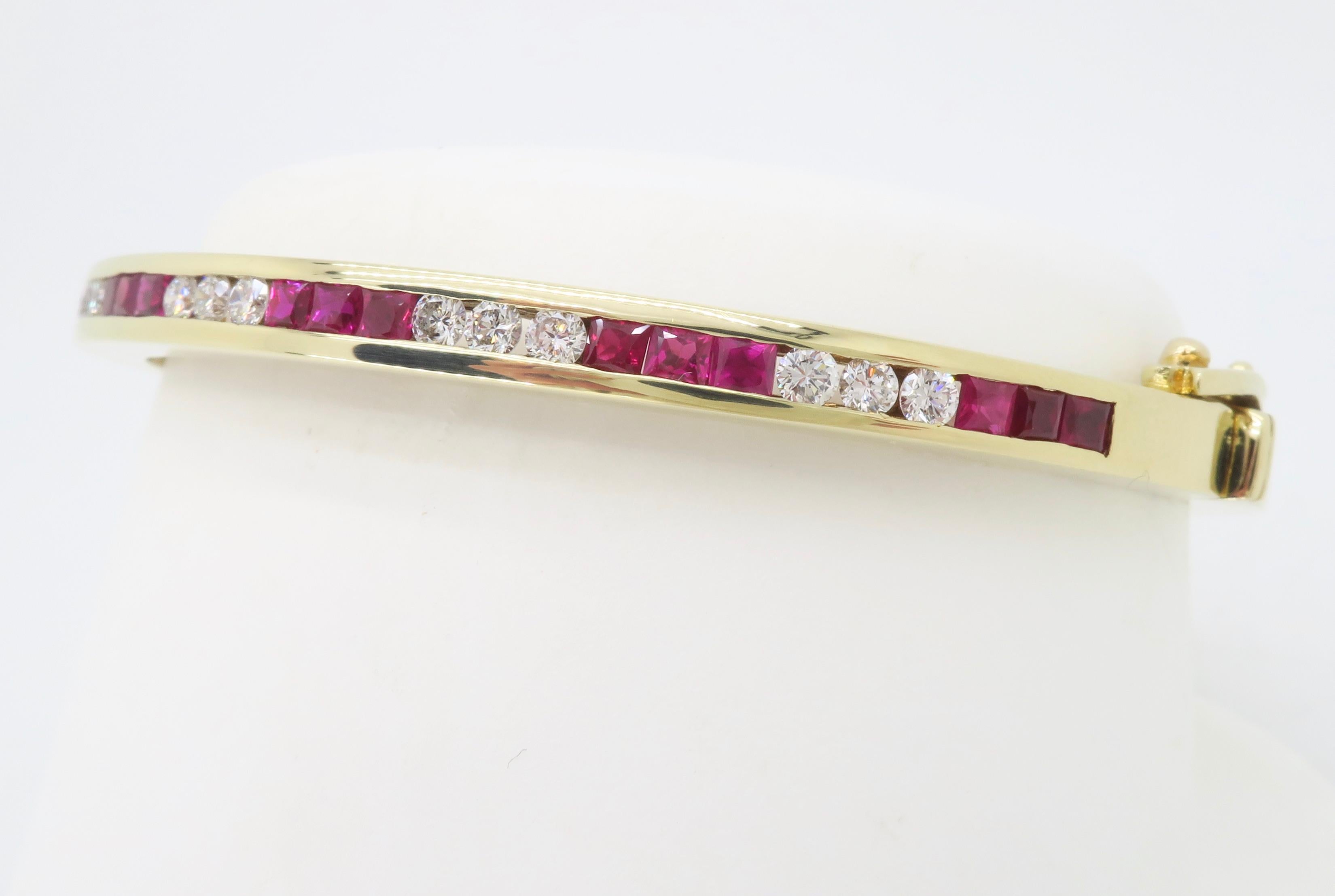 Channel set diamond and ruby bangle bracelet crafted in 14k yellow gold.

Gemstone: Diamond and Ruby
Gemstone Weight: Approximately 1.41CTW
Diamond Carat Weight: Approximately .61CTW
Diamond Cut: Round Brilliant cut Diamonds / Princess Cut Rubies