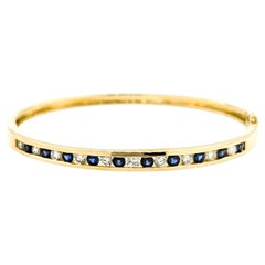 Channel Set Diamond & Sapphire Bangle Bracelet in Yellow Gold