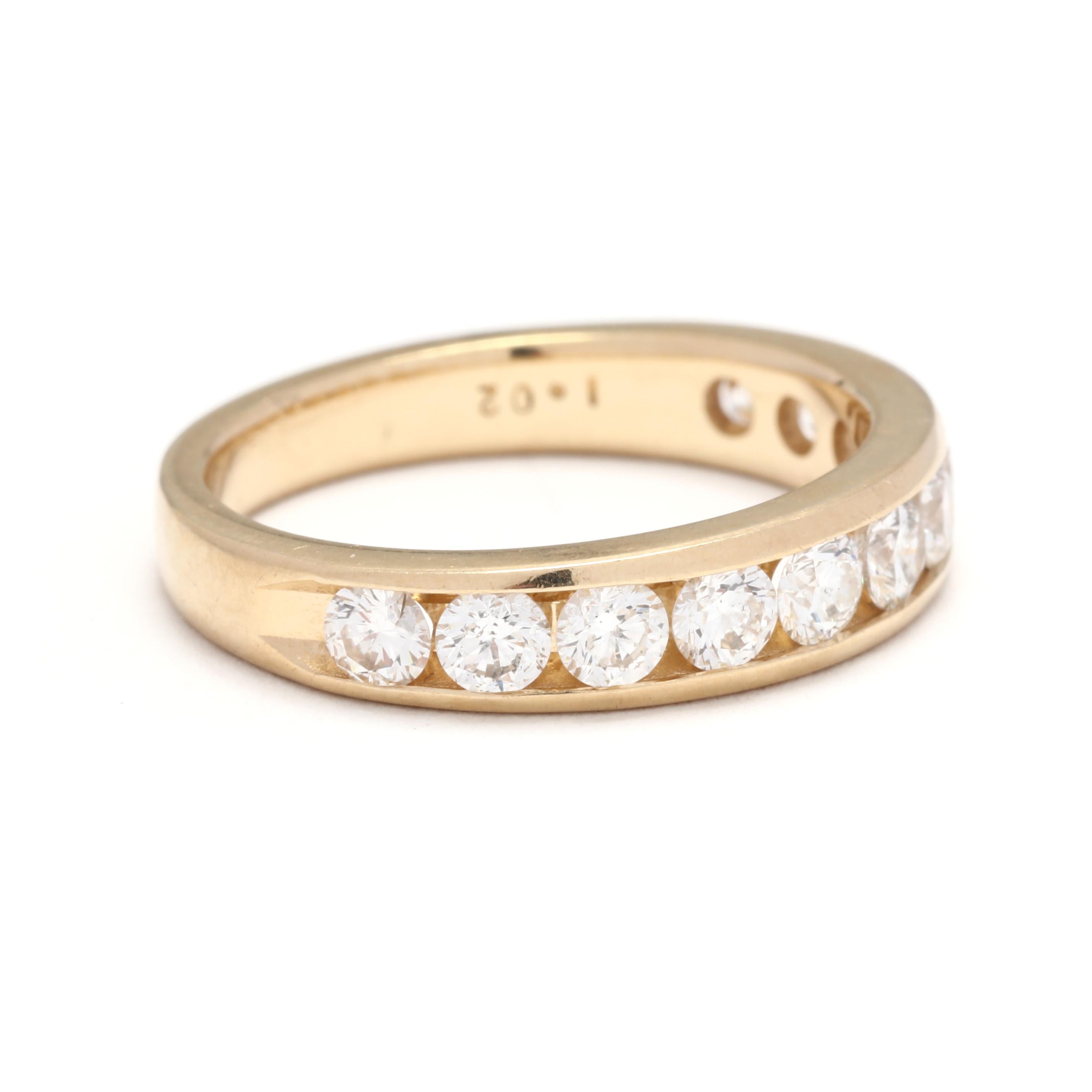A 14 karat yellow gold channel set diamond wedding band. This wide wedding band features eleven channel set, round brilliant cut diamonds weighing approximately 1.02 total carats and with a straight band.

Stones:
- diamonds, 11 stones
- round