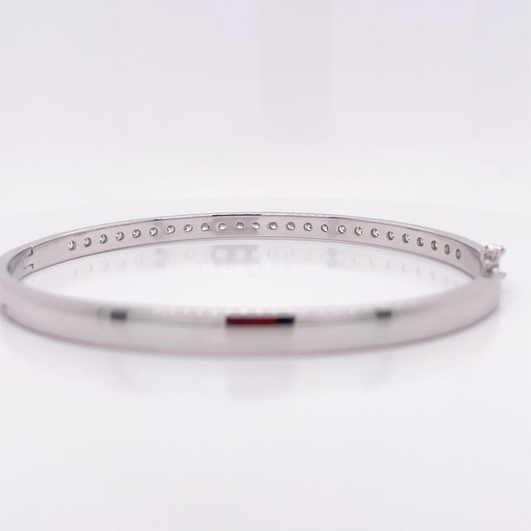 Channel Set Diamond White Gold Bangle Bracelet For Sale at 1stDibs