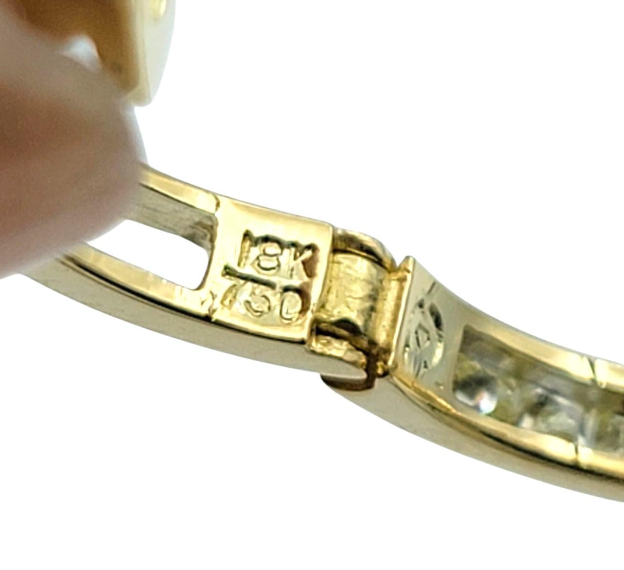 Channel Set Emerald Cut Diamond Huggie Hoop Earrings in 18 Karat Yellow Gold For Sale 1