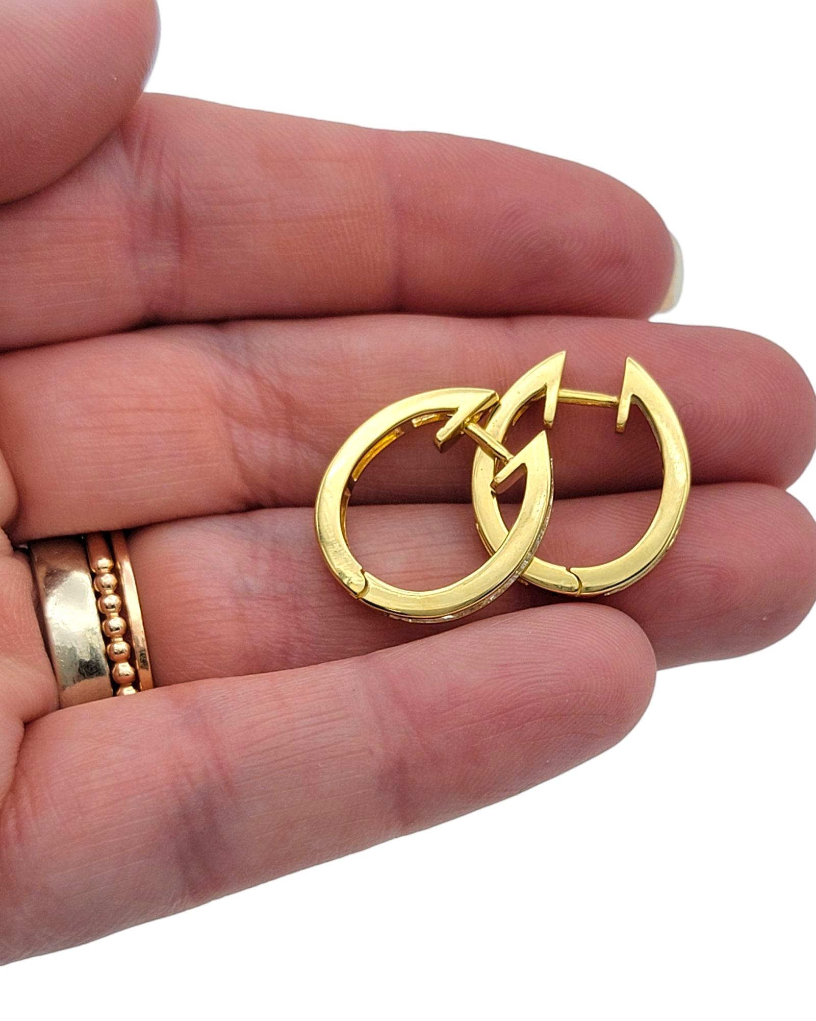 Channel Set Emerald Cut Diamond Huggie Hoop Earrings in 18 Karat Yellow Gold For Sale 3