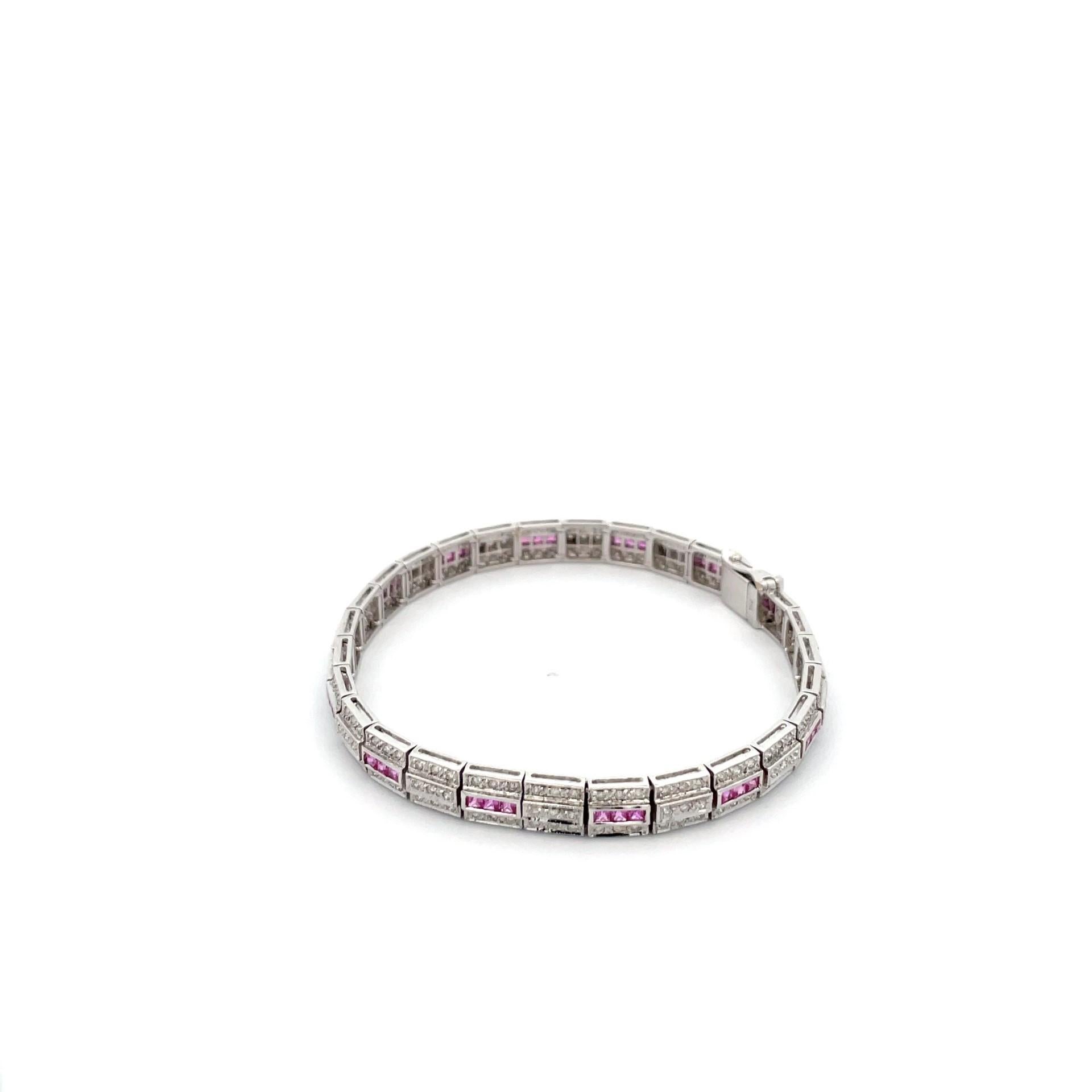 One 18kt white gold bracelet set with channel set princess cut  natural pink sapphires and natural brilliant cut diamonds. 

42 natural pink sapphires weighing 2.29ct total weight

214 brilliant cut diamonds, weighing 1.18ct total weight

Gold 18kt