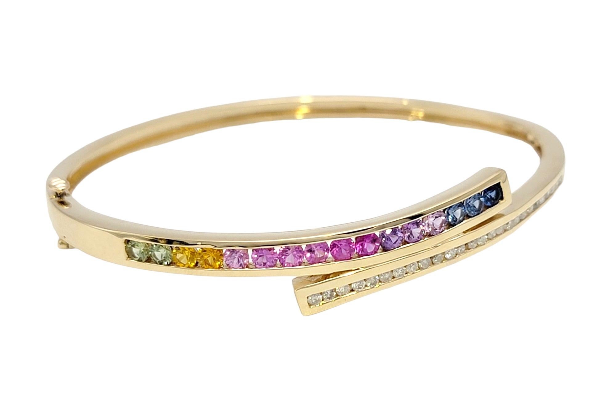 Round Cut  Channel Set Rainbow Sapphire and Diamond Bypass Bangle Bracelet in Yellow Gold For Sale