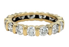 Channel Set Round Cut Diamond Eternity Band Ring in 14 Karat Yellow Gold