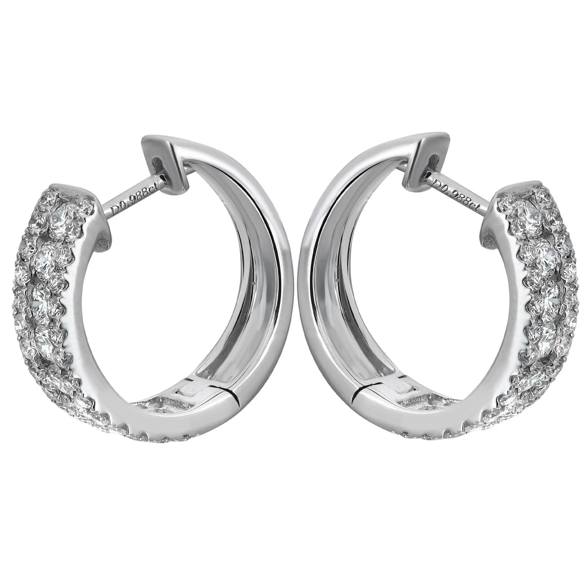 These glamorous diamond huggie earrings feature a center row of channel set dazzling round brilliant cut diamonds with prong set round cut diamonds. Total diamond weight: 1.10 carats. Encrusted in lustrous 18K white gold. Diamond quality: color G-H