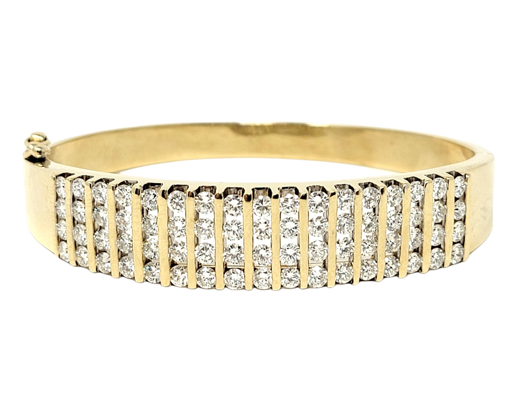 Absolutely gorgeous diamond bangle bracelet bursting with sparkle! This stunning piece features an impressive 5.50 carats total of sparkling white diamonds, round brilliant cut, H-I color and VS-SI clarity. The icy white natural diamonds are channel