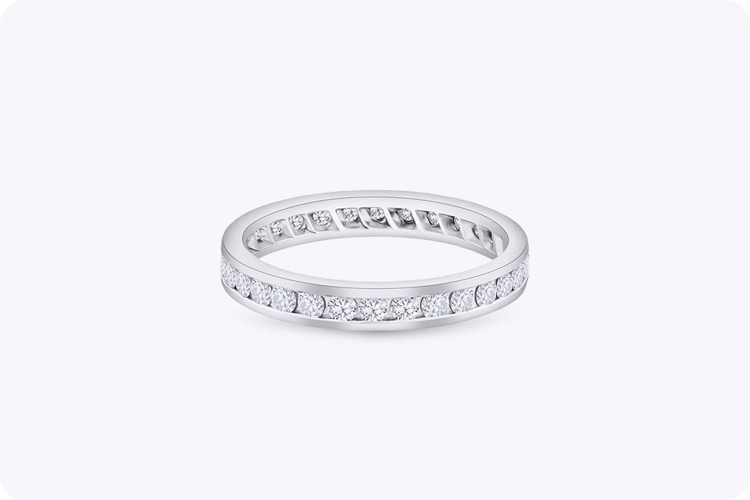A classic and chic wedding band showcasing 30 sparkling round diamonds weighing 0.98 carats total. The diamonds are channel set in 18k white gold that makes it perfect for stacking with a gorgeous engagement ring. Size 7.5 US.

Roman Malakov is a