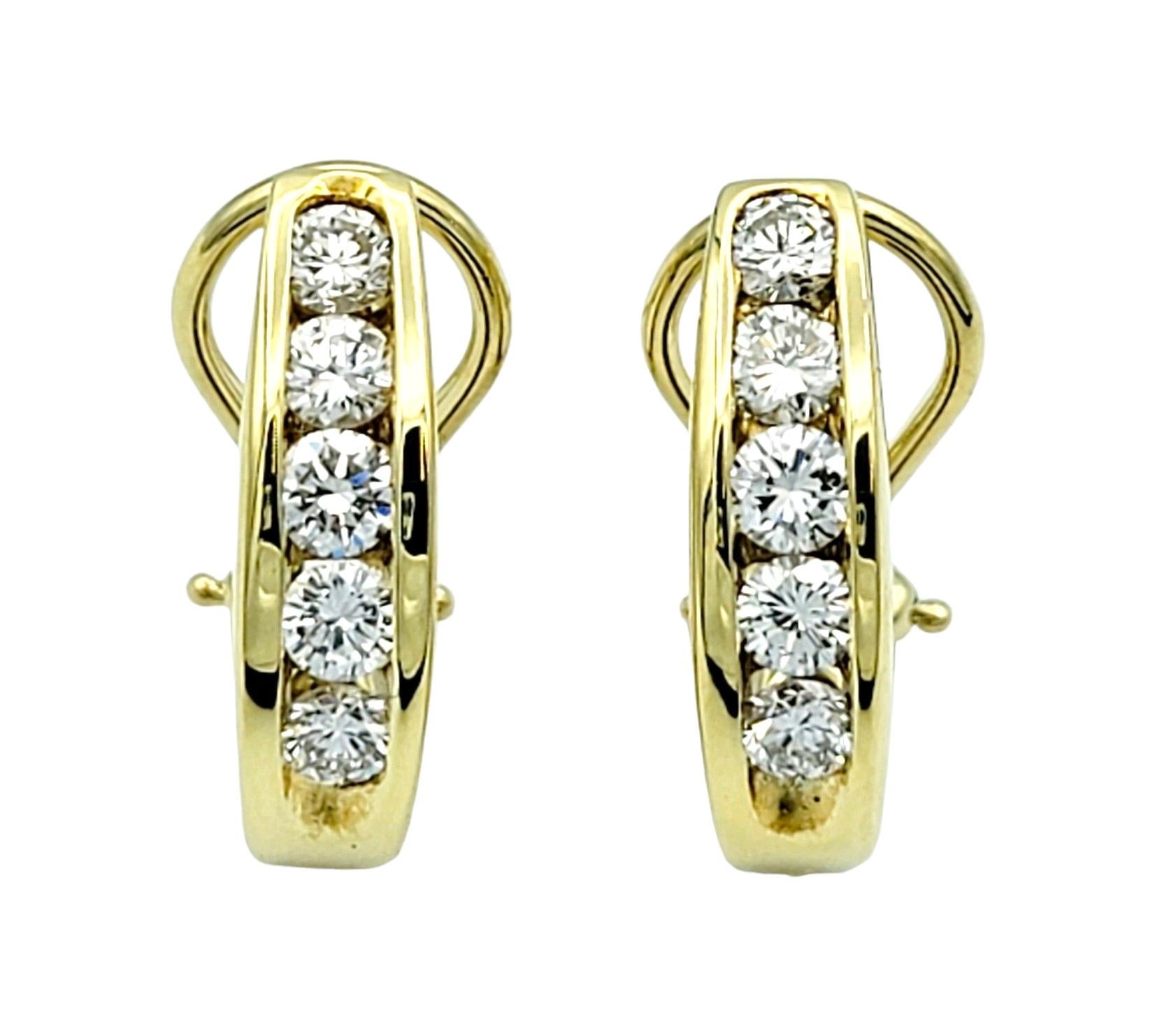 Simple yet stunning 18 karat yellow gold and diamond half hoop earrings. We love the striking contrast of the icy white diamonds against the golden hue of the precious metal, allowing the diamonds to really pop!

These gorgeous earrings feature a