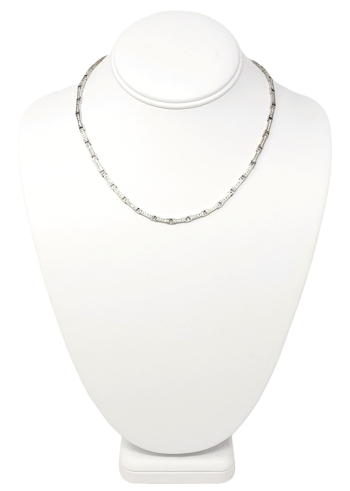 Strikingly beautiful minimalist choker style necklace. It is stunningly simple in design, with curved lines and glittering diamonds, making the piece absolutely glow! This lovely necklace features a series of solid 14 karat white gold open bar links