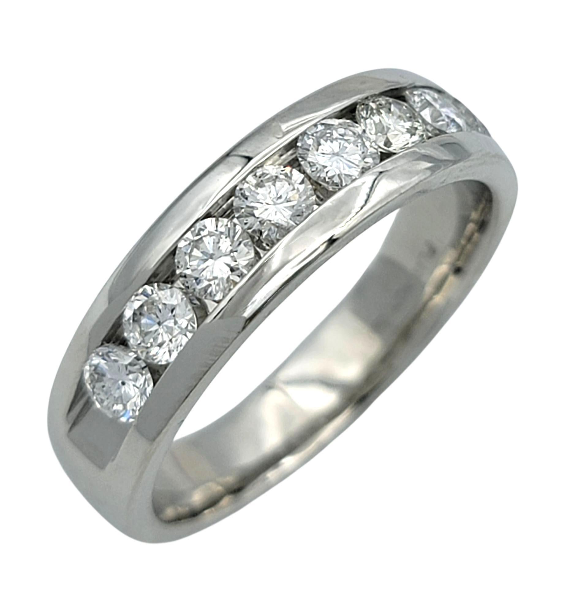 This chic band ring features a clean row of bright diamonds set neatly across the top, giving it a continuous, even sparkle. Each stone is held in a smooth channel that adds structure while keeping the design sleek and modern. The band itself has a