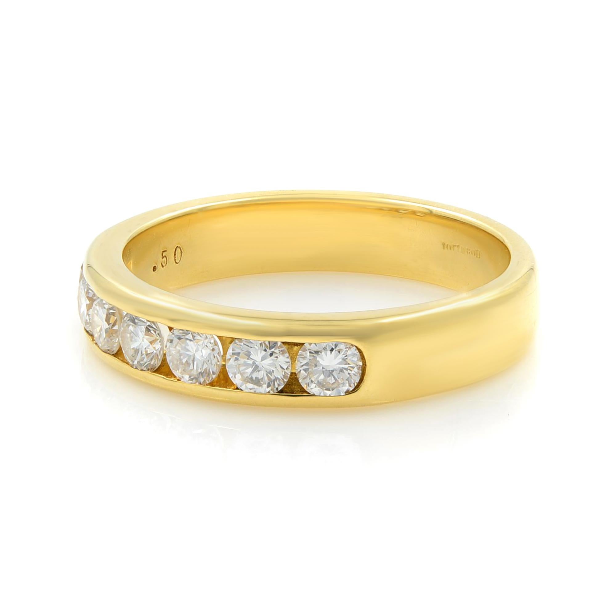 This is a super, newly-crafted diamond wedding band rendered in rich 18k yellow gold. Adorned with channel set seven perfectly matched high-color, high-clarity round brilliant-cut diamonds weighing 0.50 cttw. This ring can be specially ordered in
