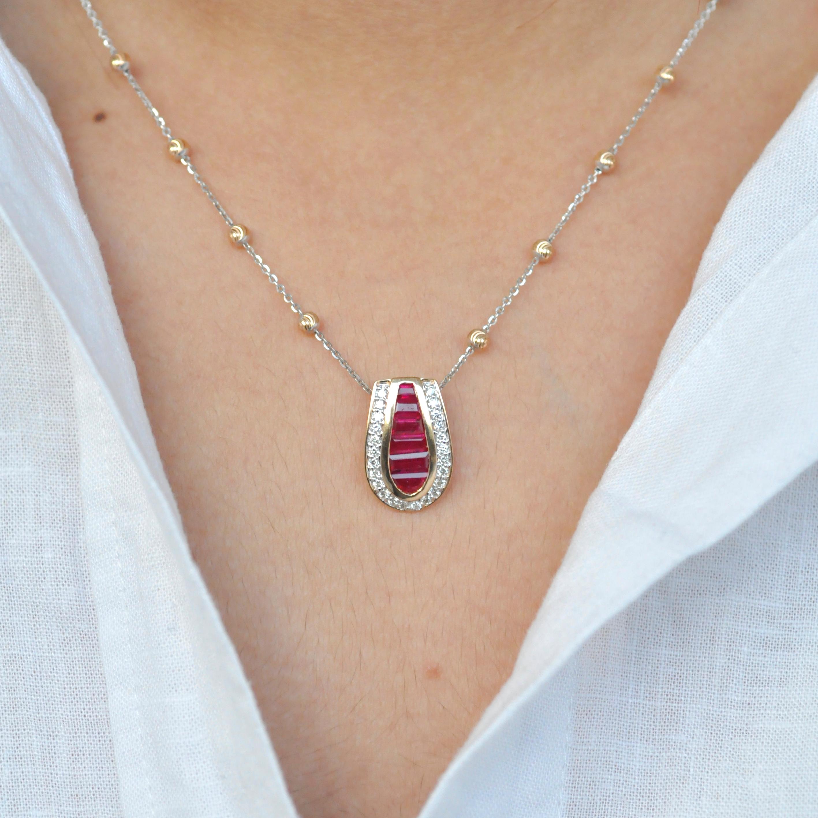 18 karat gold channel set burma ruby baguettes diamond art deco style pendant necklace.

Presenting a 18 karat gold art deco channel set ruby baguette diamond pendant necklace. The natural burmese ruby baguettes are meticulously handpicked after