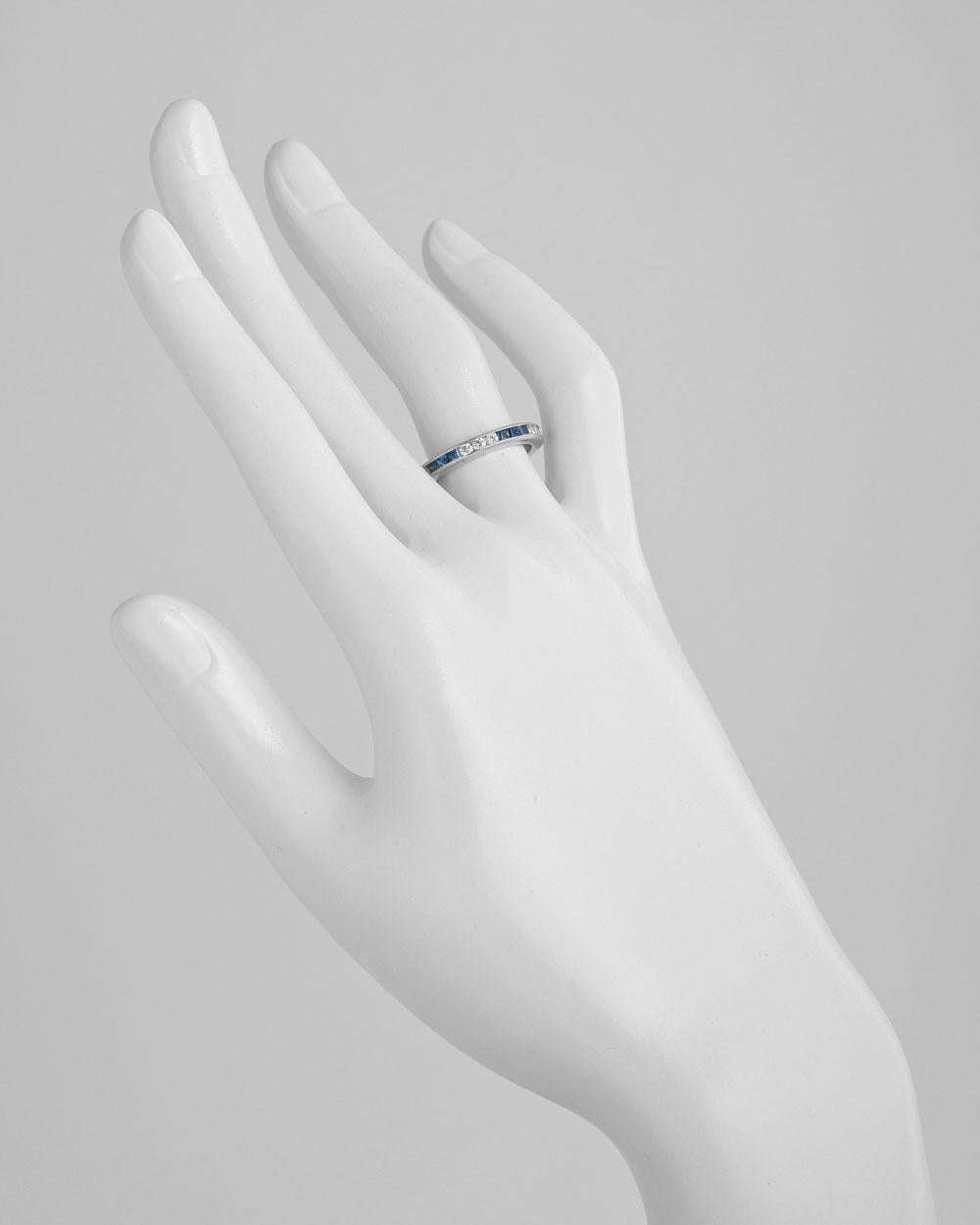 Channel-set eternity band ring, showcasing three square-cut sapphires alternating with three round-cut diamonds, in polished platinum.
 
Diamonds weighing 0.53 total carats
2.9mm wide
Size 6.5