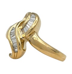 Channel Set Tapered Baguette Diamond Knot Motif Band Ring 14 Karat Yellow Gold