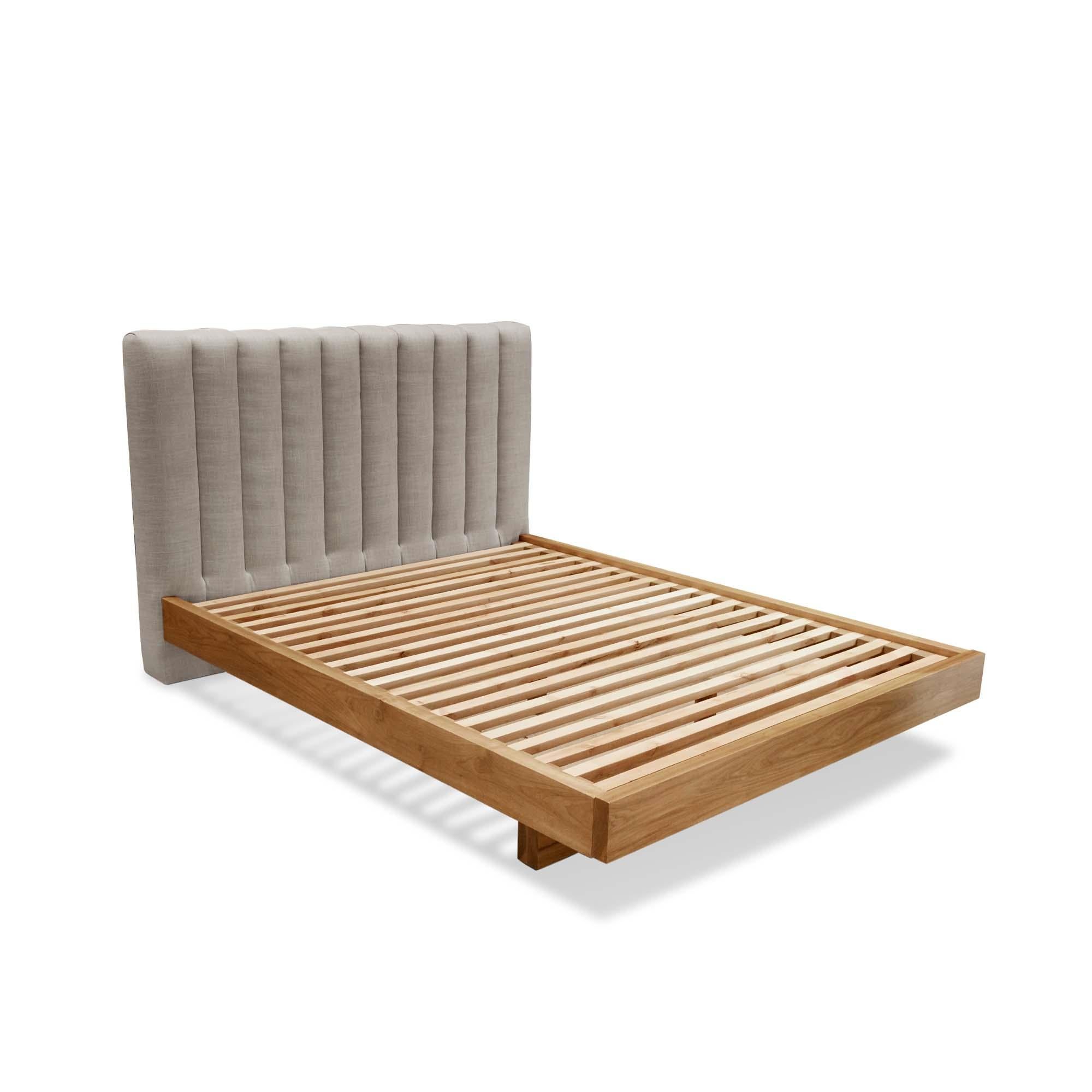 The Capitan bed features a channel tufted headboard and a minimal, Japanese-inspired wood platform. Available in American walnut or white oak. Shown here in linen and natural walnut. Queen size.

The Lawson-Fenning Collection is designed and