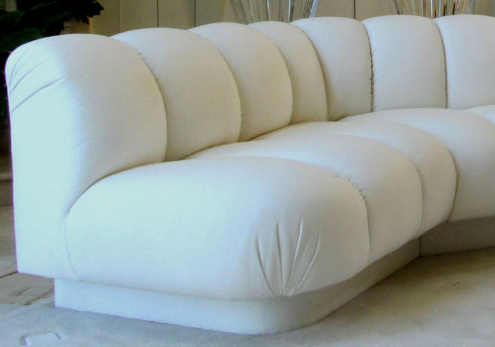 Channel tufted modern sectional sofa by designer Steve Chase. Three piece sectional sofa upholstered in white railroad corduroy fabric. Channel Tufting in signature Steve Chase style, this sofa is both beautiful and very comfortable. Has clips