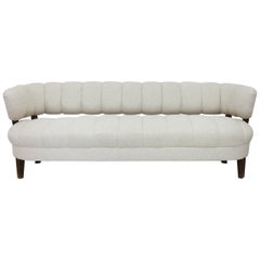 Channeled Back Armless Settee with Back Stretchers and Solid Seat on Wood Legs