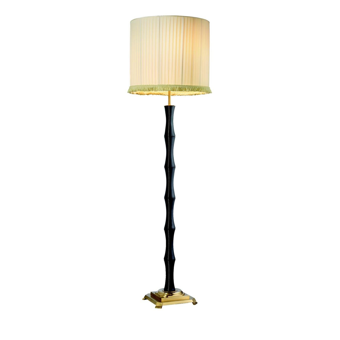 Skilled works with consolidated experience, raw materials selection and care in the end finishing’s, put the Estro product to the highest quality standards. This Chantal floor lamp is finished in brass satin gold with shaft covered by and sewed in