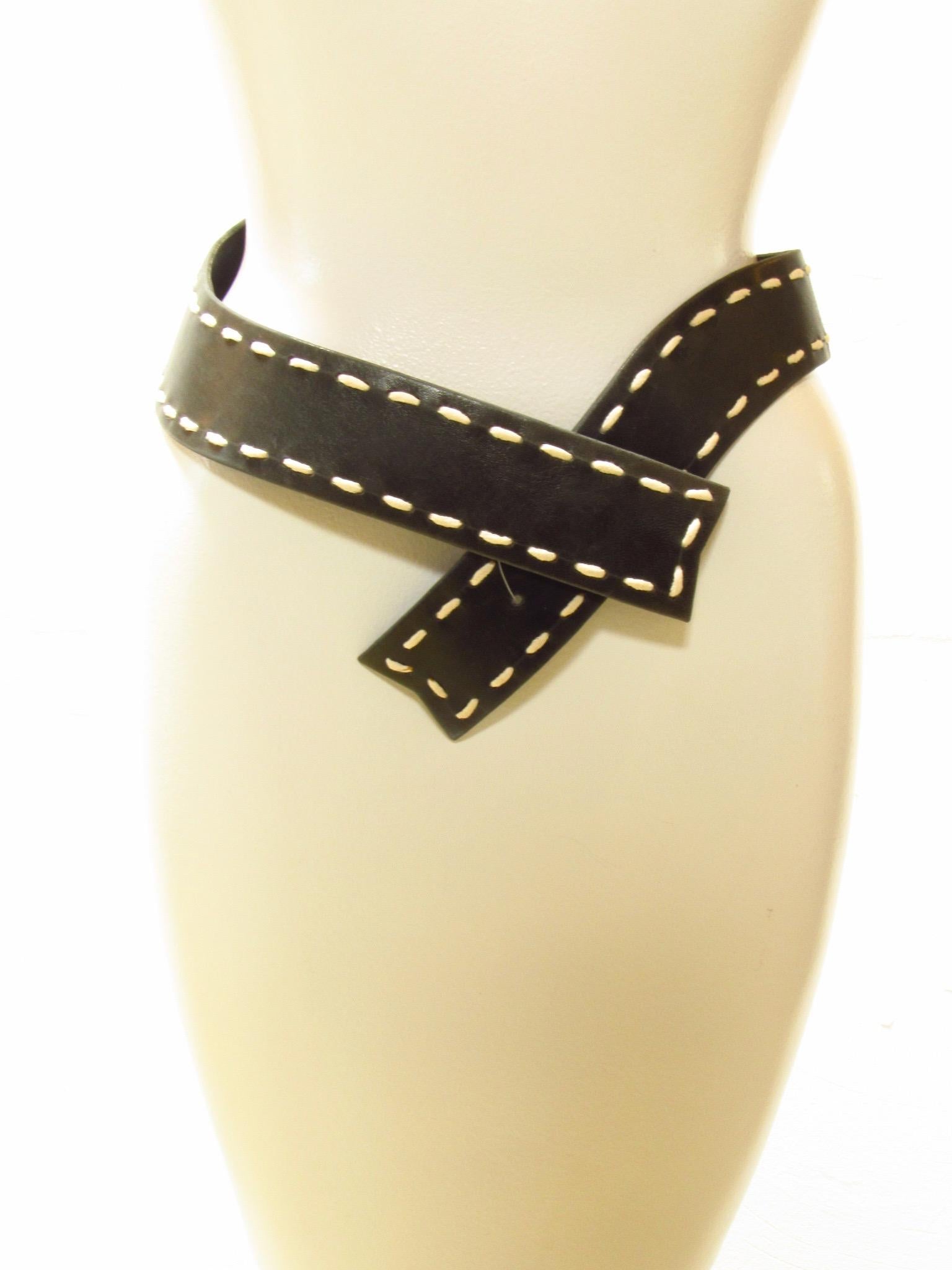 Curvaceous black belt from Chantal Thomass has striking white stitching around the edges. Secures with an inner hook.