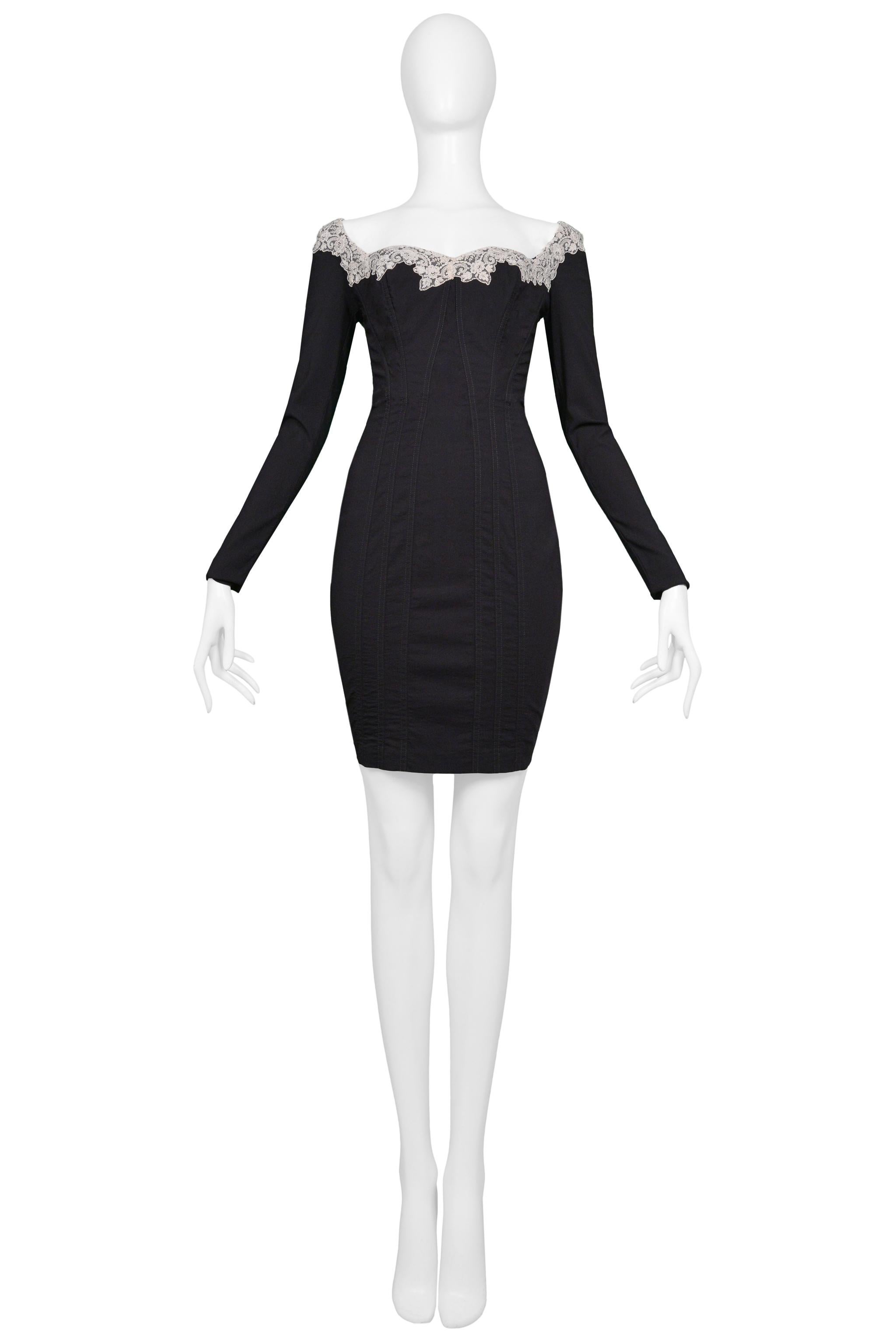 Resurrection Vintage is excited to offer a vintage Chantal Thomass black corset dress with stretch featuring lace collar, fitted body, long sleeves, and center back zipper. 

Chantal Thomass
Size 38
75% Wool, 20% Polyamide, 5% Lycra
1995 Collection