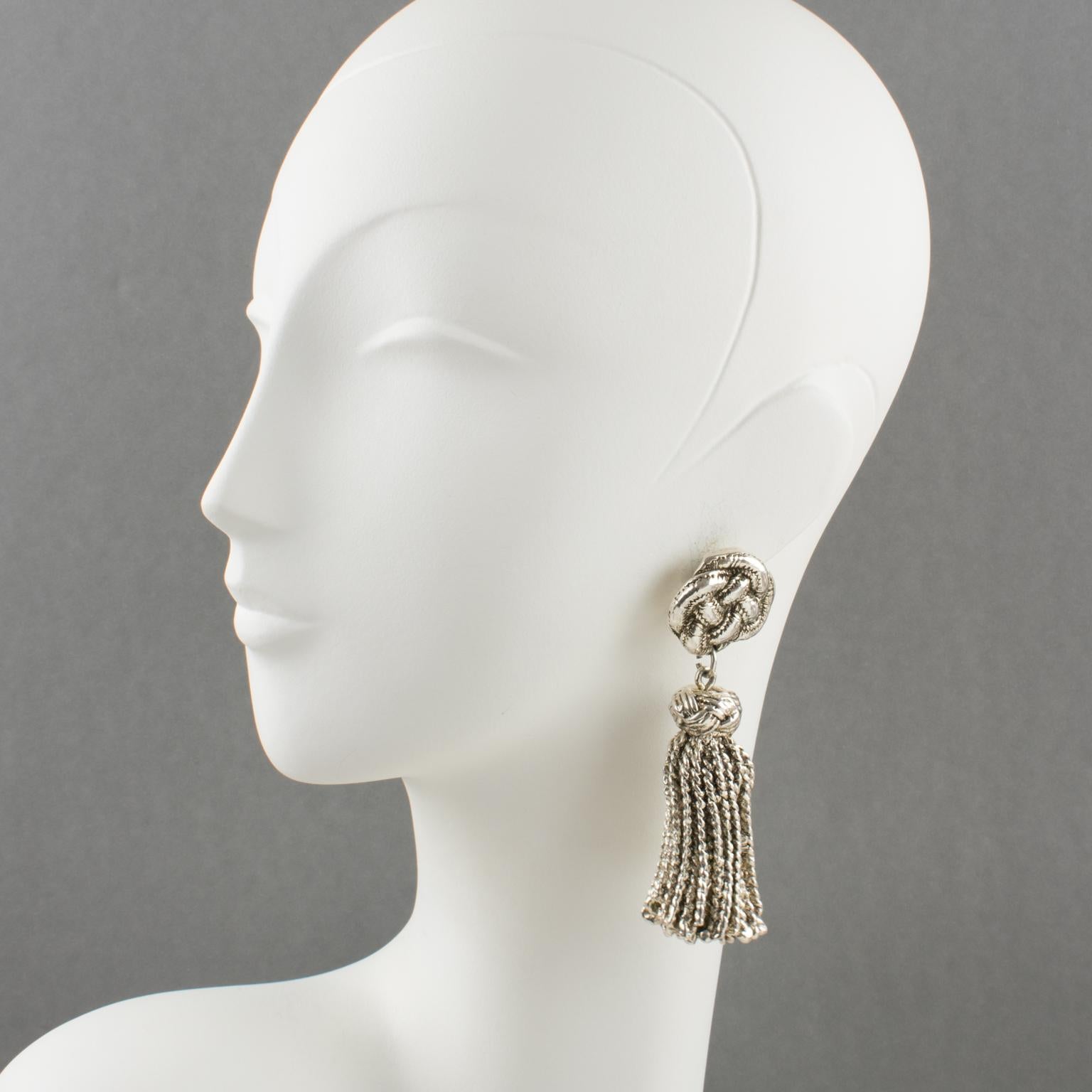 Lovely French designer Chantal Thomass Paris clip-on earrings. Dangling shape, featuring silvered-metal coated resin braided rounded fittings compliment with an oversized tassel. Marked underside with the company logo. 
Measurements: 3.75 in. high