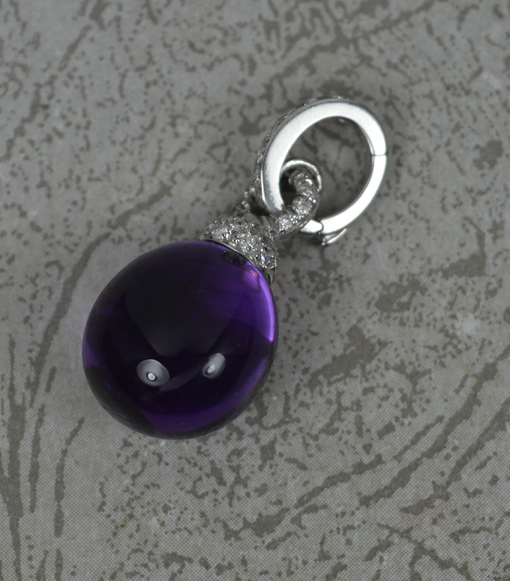 A superb contemporary pendant by Chantecler.

Solid 18 carat white gold.

Designed with an amethyst cabochon drop to base. Above are many round brilliant cut diamonds, pave set. Complete with diamond set bale.

CONDITION ; Excellent. Beautiful