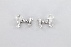 Gemelos Chantecler con cristal de roca grabado y diamantes en oro de 18 quilates