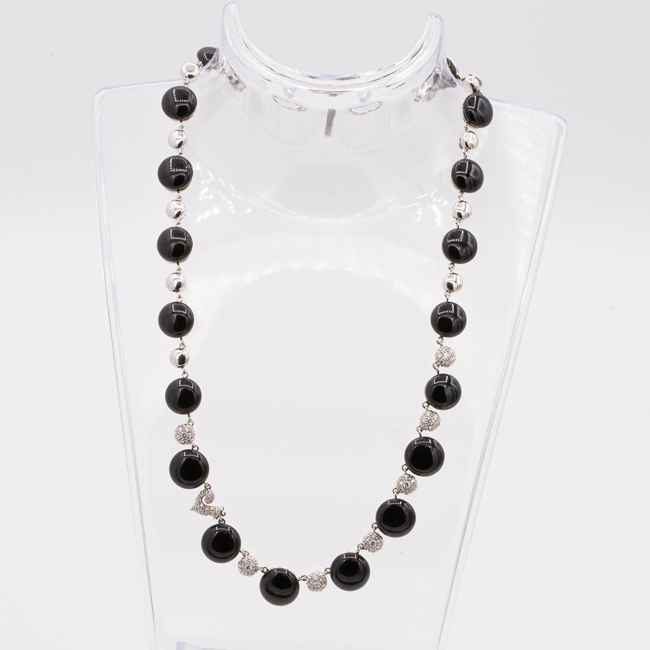 Chantecler jewelry is inspired by the Island of Capri's exotic natural environment. Bon Bon black onyx and pave diamond station necklace handcrafted in 18k white gold.