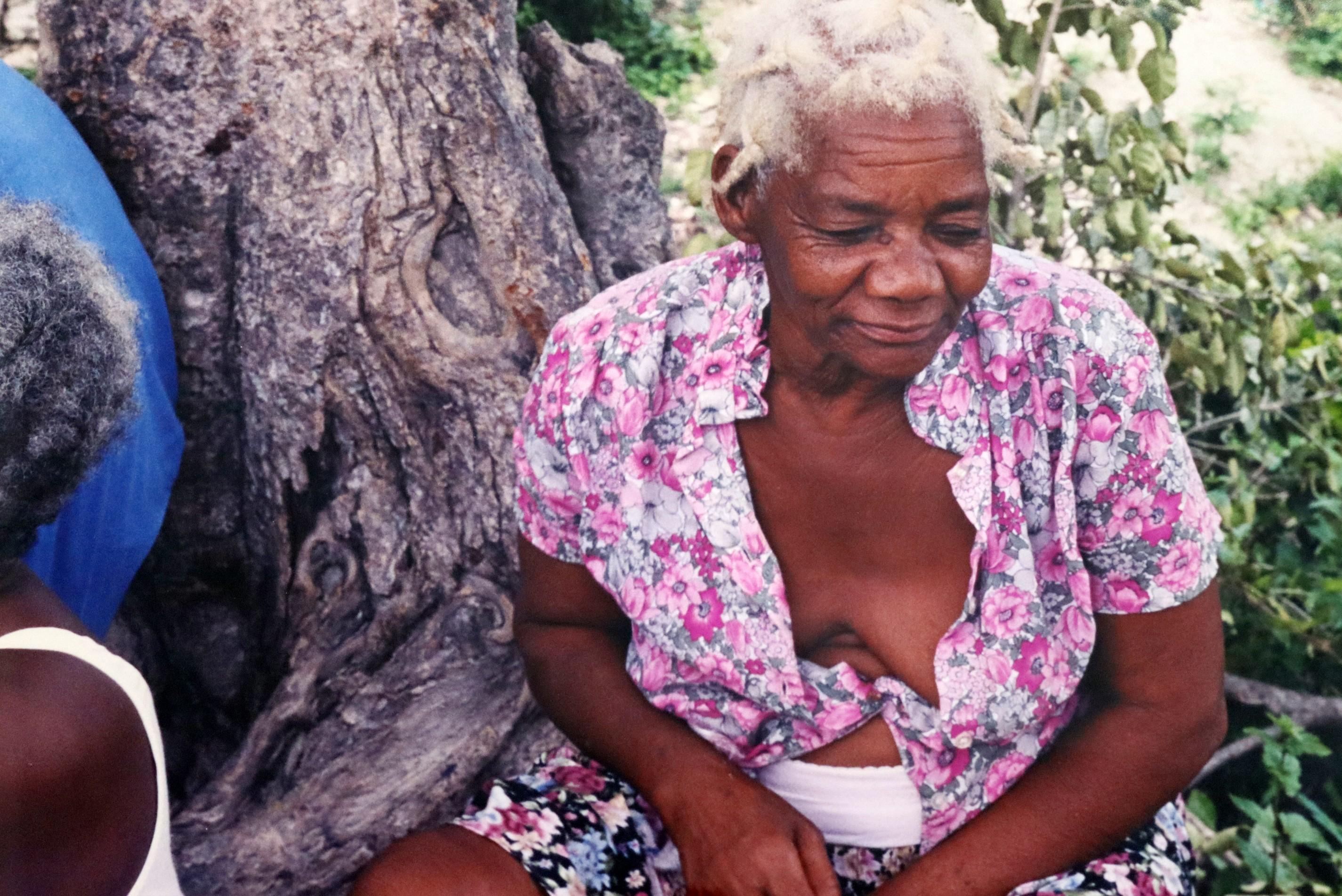 For your consideration is a rich, vibrant, contemporary photograph depicting a Haitian elderly woman by award winning photographer Chantel James. Dimensions: 16h x 22w (framed). In excellent condition. 

Chantal James is known for being included