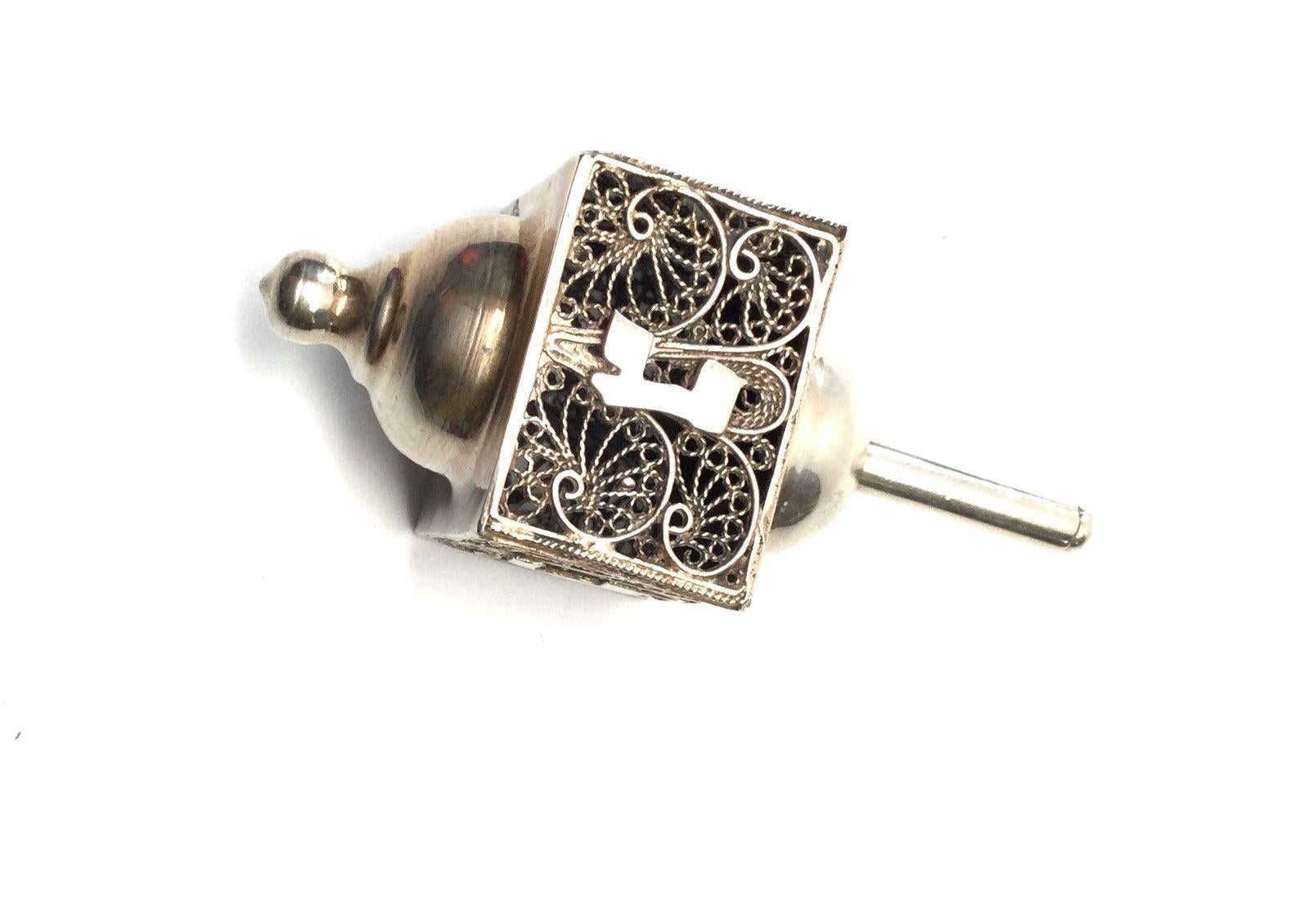 Chanukkah Hanukkah sterling silver dreidel. This is a beautifully designed dreidel with filigree pattern. This is a perfect and great gift for the Hanukkah collector. Measurements: 3