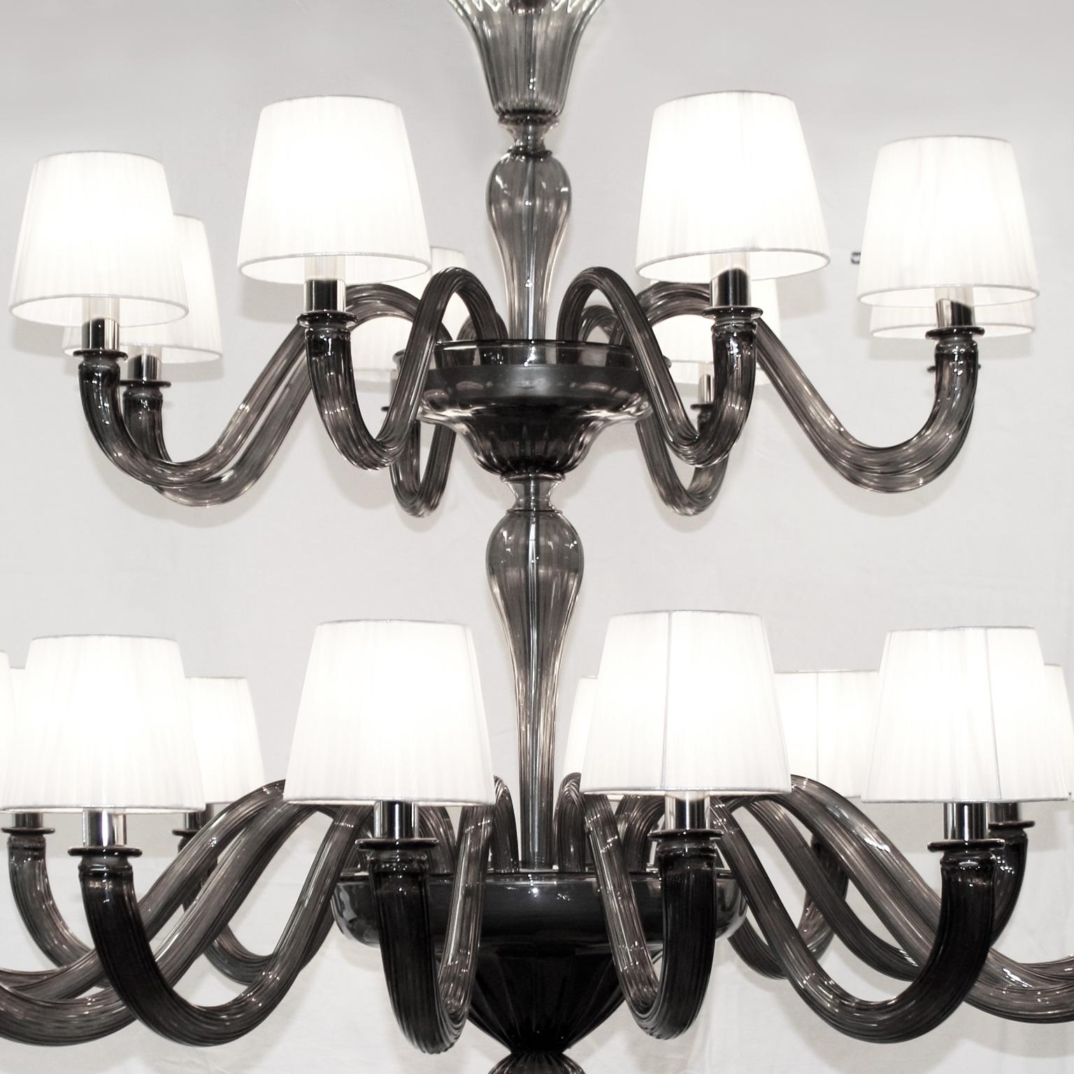 Chapeau is a Classic and essential chandelier, it is handcrafted using high quality materials in Murano glass and handmade organza lampshades.
This Murano glass chandelier is finished with handmade lampshades, and it is available in many different