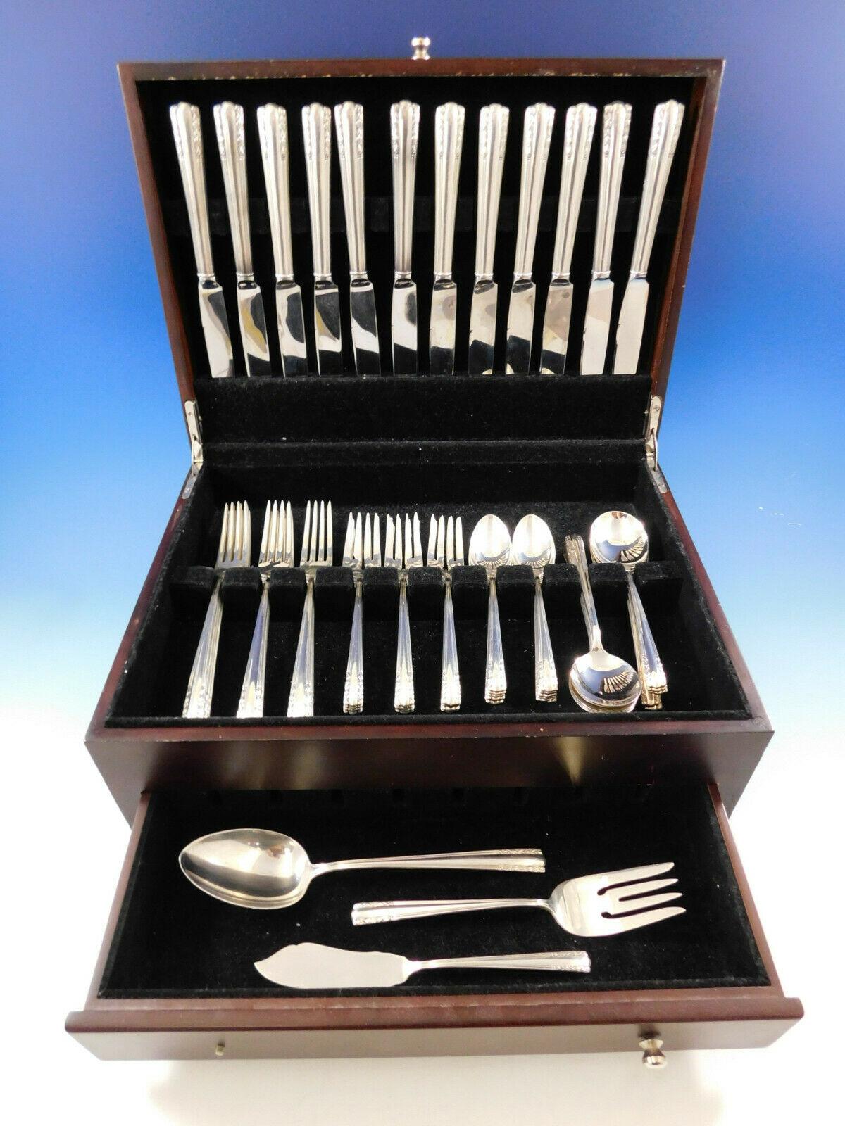 Dinner size Chapel Bells by Alvin sterling silver flatware set - 63 pieces. This set includes.

12 dinner size knives, 9 1/2