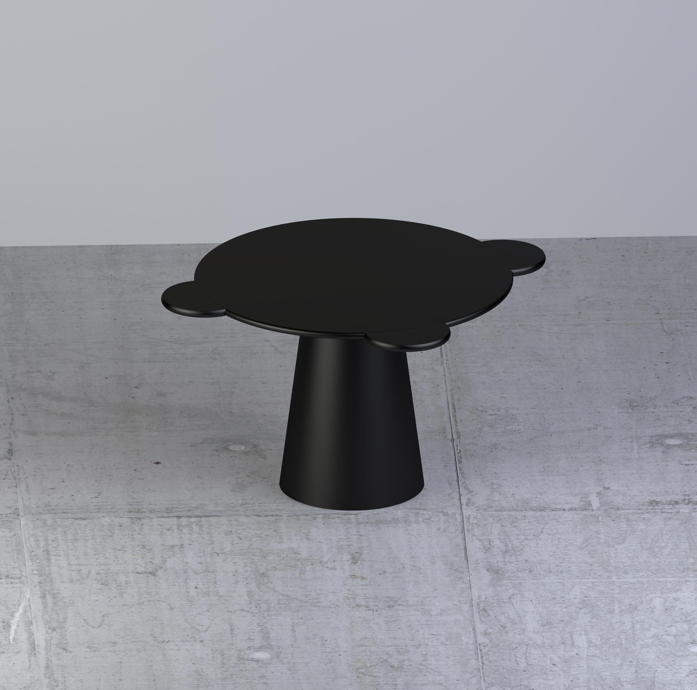 Donald is a multifunctional table with a sculpturally cosmic aspect and colorful circular shapes.

The sculptural silhouette has a wooden structure composed of a truncated cone that supports a round top adorned with three semi-circular flaps,