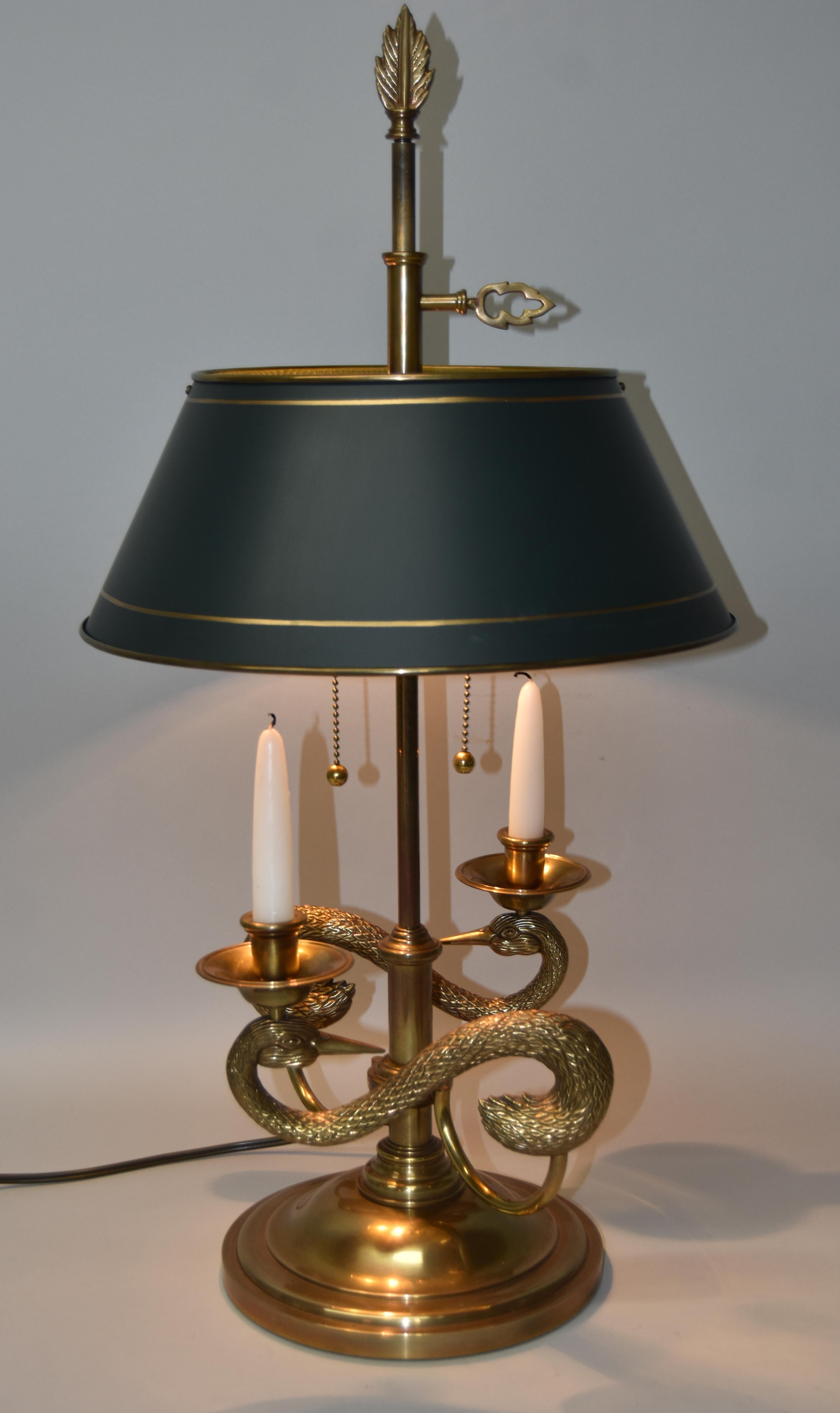 Chapman solid brass double arm table lamp with swan motif and a pair of candleholders. Hand painted gold banding on dark green brass tole shade. Shade can be adjusted. Two sockets have ball pulls. Comes with a light diffuser.
