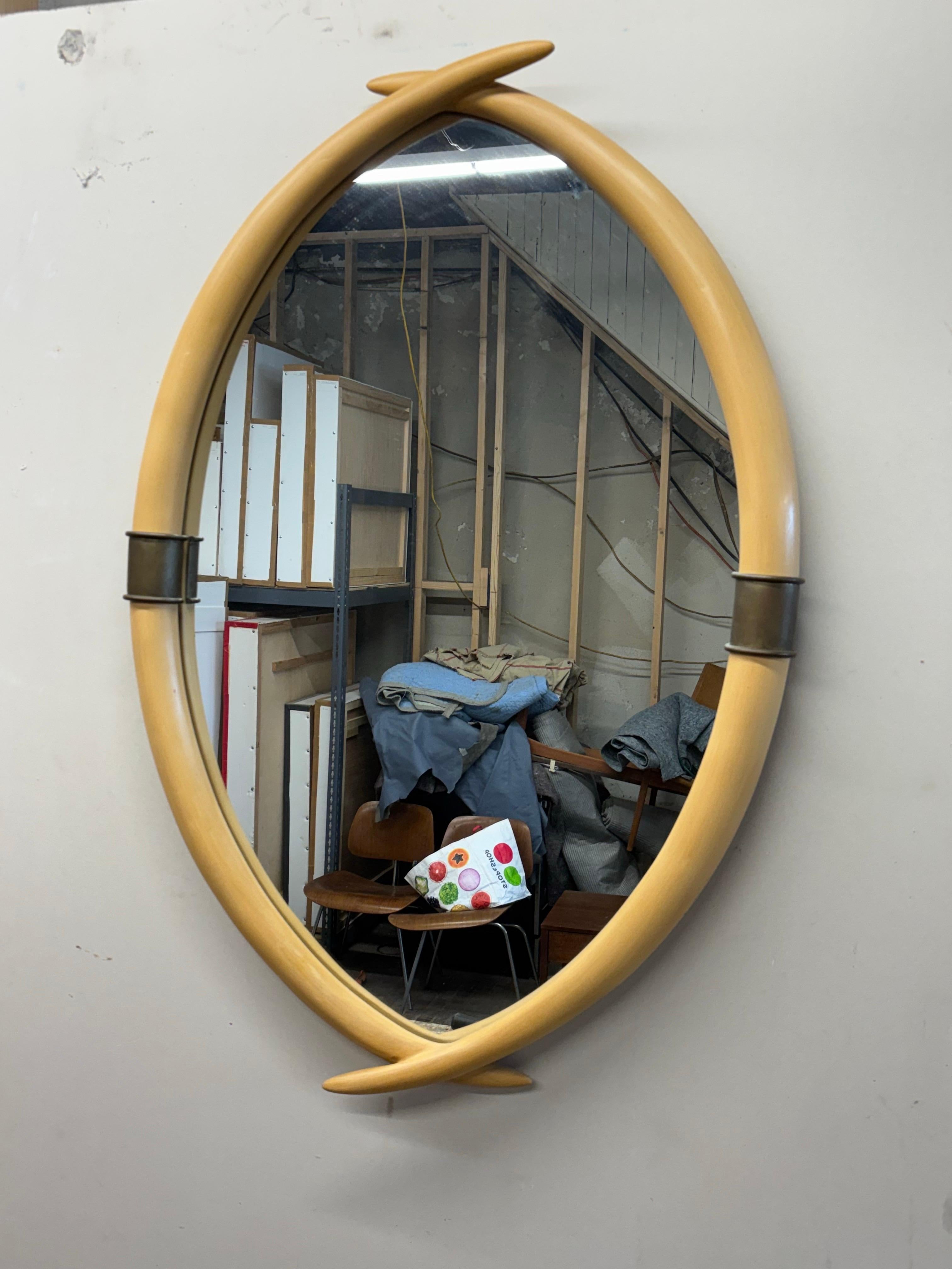 Chapman Faux Elephant Tusks Mirror.  Label and date to the back.  Lacquered wood construction with brass center pieces.  Overall in nice condition!  Ready to hang!