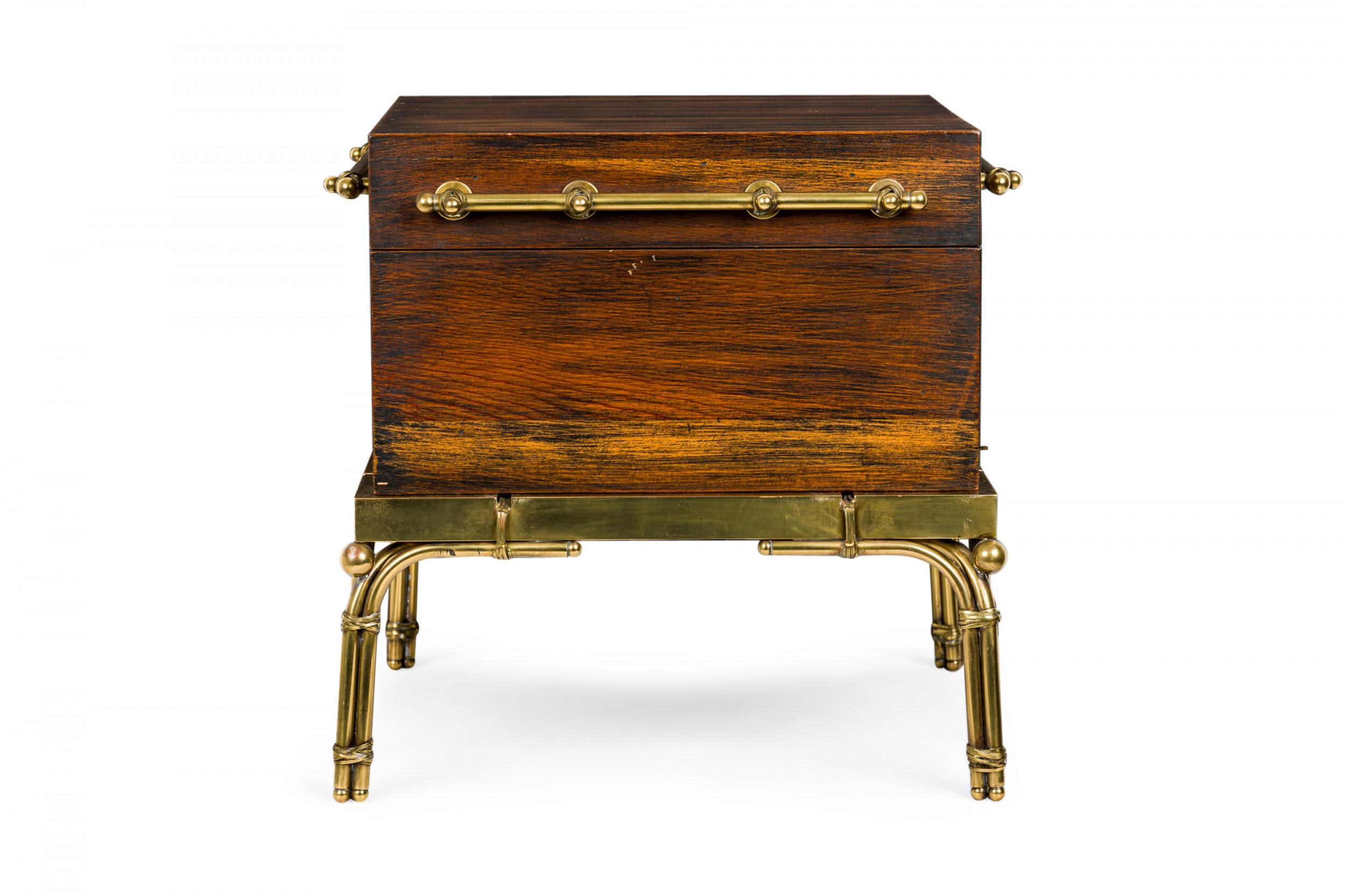 American Mid-Century strong box / chest with a painted and lacquered walnut hinge top case with wire wrapped brass handles, resting on a four-legged brass base. (CHAPMAN / MASTERCRAFT).