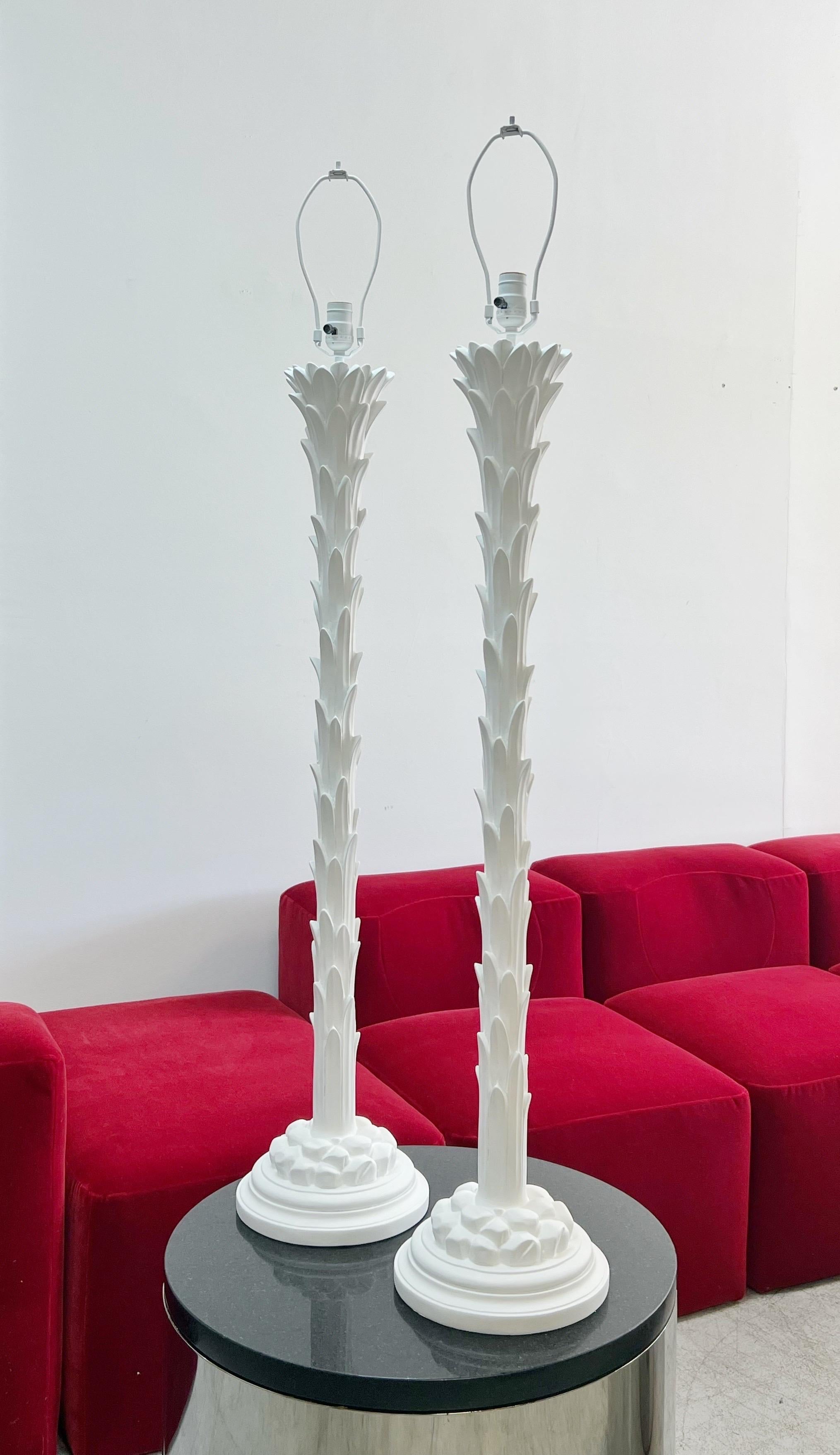 A pair of iconic floor lamps by Chapman in the style of Serge Roche. Retain label on bottom of base from 1972.