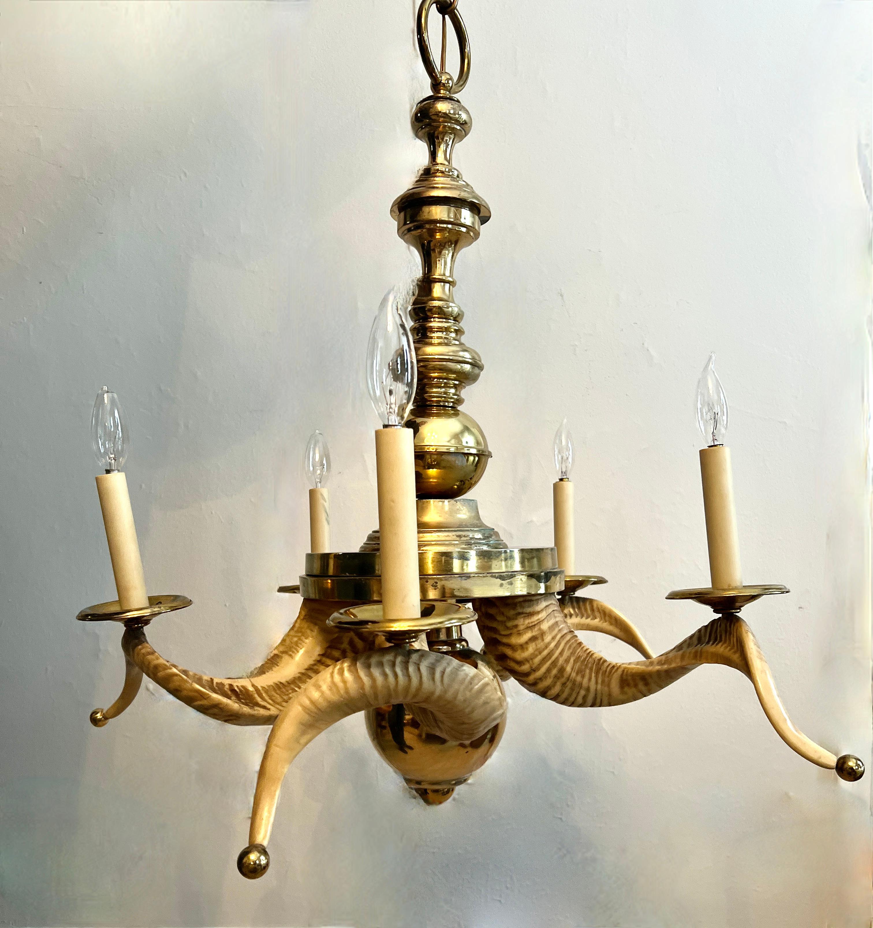 A Chapman Brass and Rams Horn Chandelier with 5 Lights.  This Mid Century piece is a wonderful Organic material mixed with fine brass accents.  

The Brass details of varying sizes, as the bottom weighted sphere and the brass ball tips at the tip of