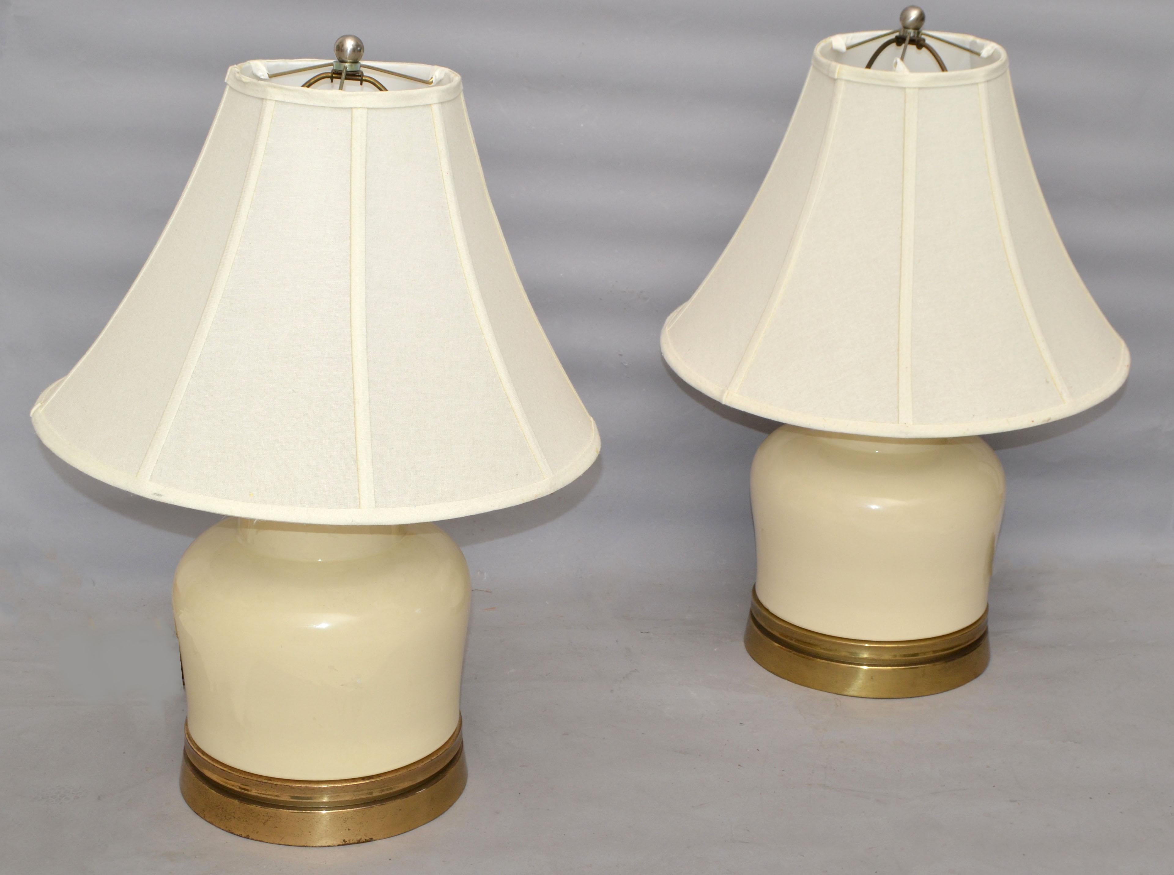 A pair of vintage Hollywood Regency Ginger Jar Ceramic & Bronze Table Lamps in the Style of Chapman.
Perfect working condition, UL Listed and each uses a regular or LED light bulb.
The set comes with harp, finial and original shades, which are