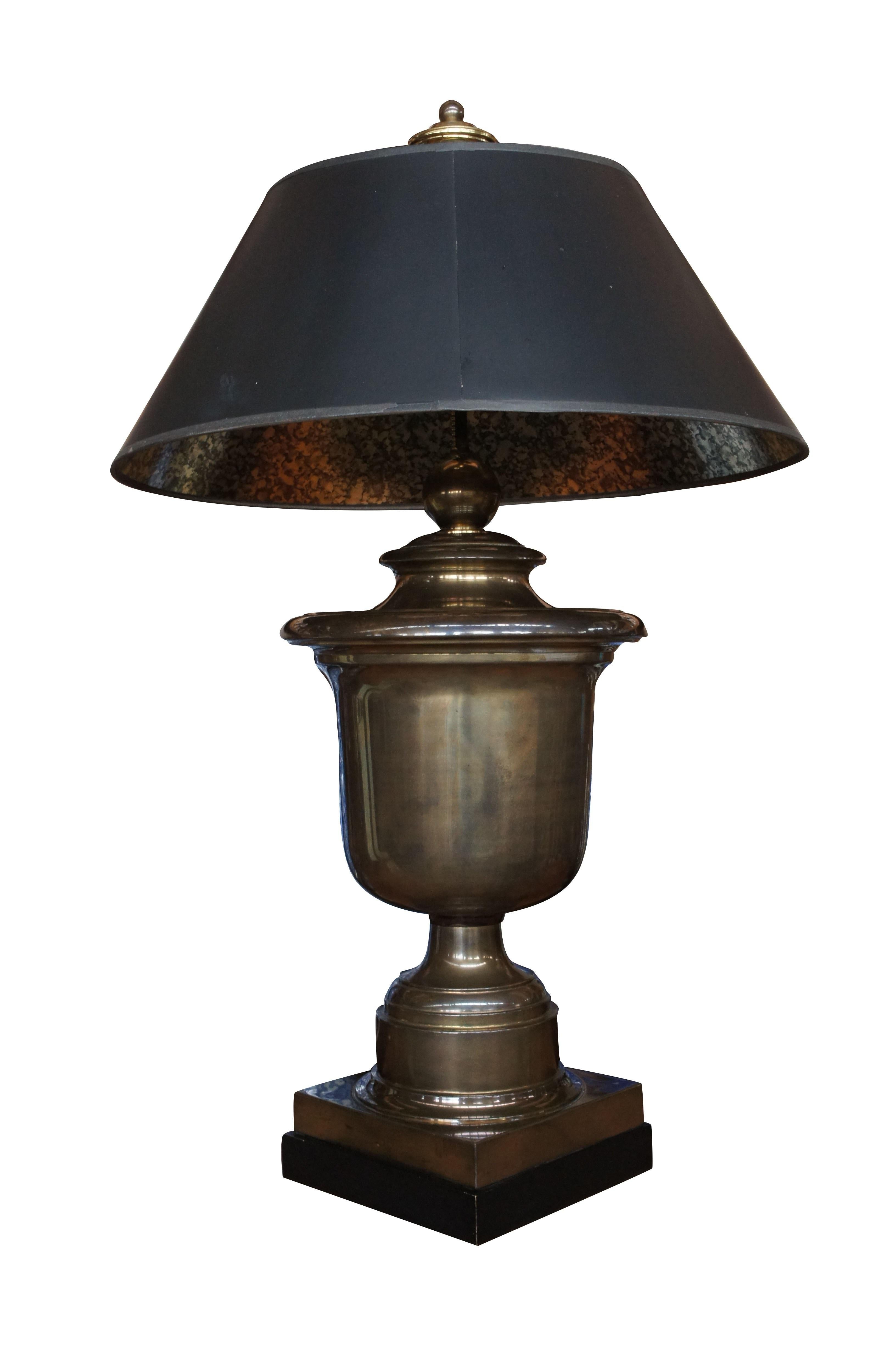 A classical yet regal design by Chapman. Made from brass with black tapered shades and foiled underside. A great addition to any setting.

Measures: 12.5
