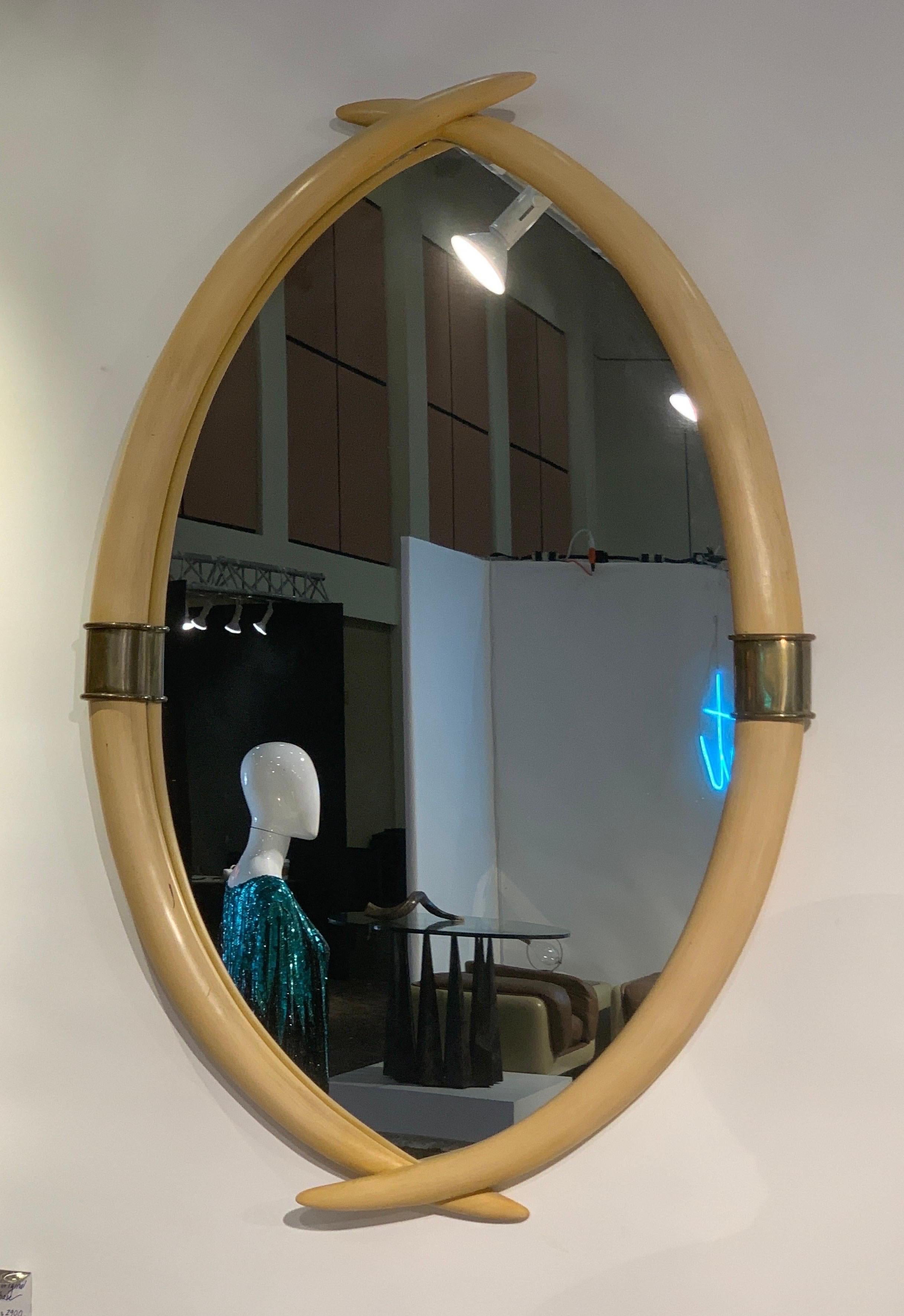These vintage mirrors made by high-end maker Chapman are very desirable currently and hard to find. This original owner mirror was found in a high-end estate in Palm Springs California. The mirror is in the form of crossed elephant tusks (looks like