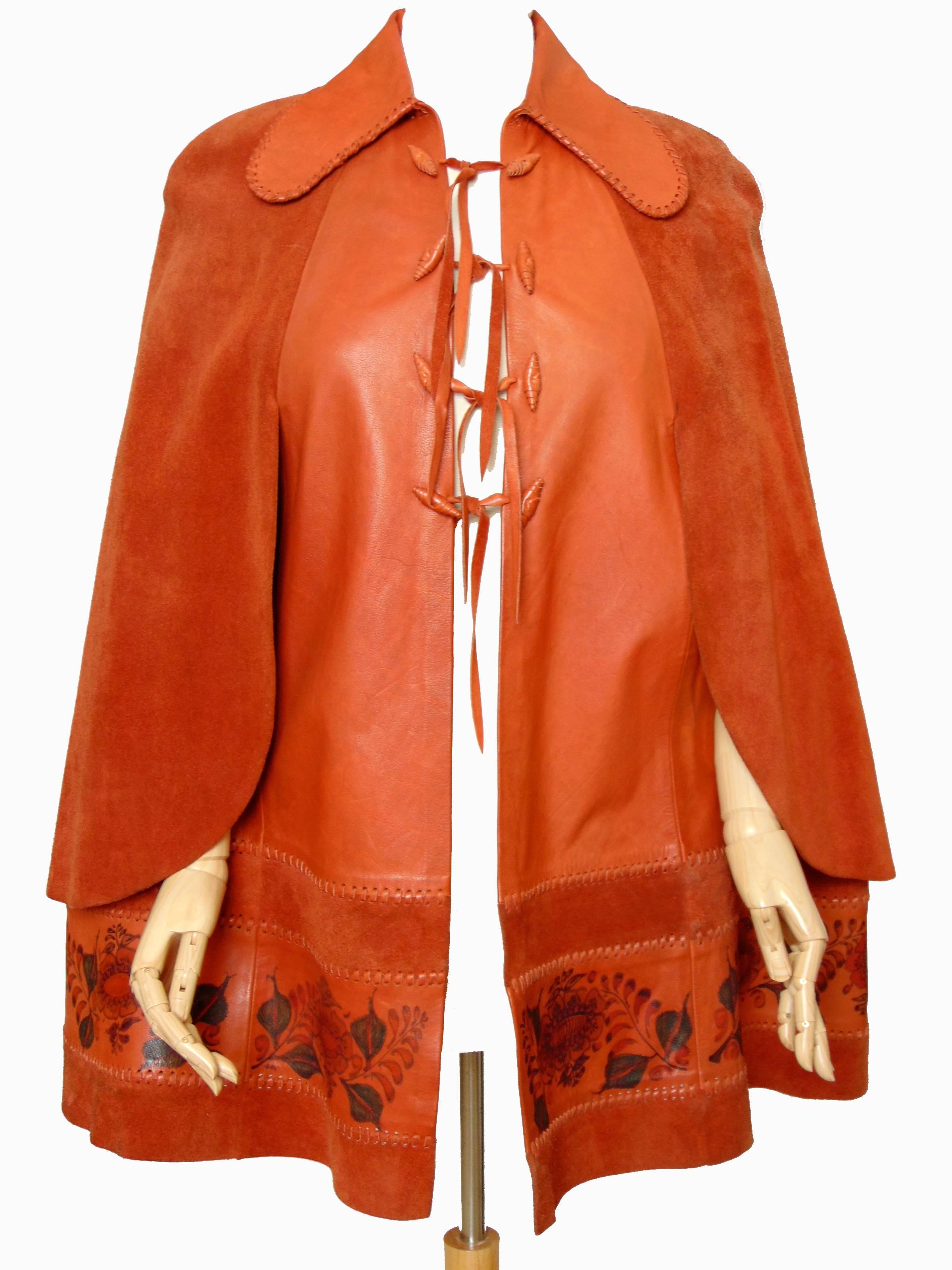 This stunning leather cape was designed by Char, Charlotte Blankenship de Vasquez, most likely in the early 1970s.  Char's original pieces are getting more and more difficult to find, and this piece is one of the few currently available online. It